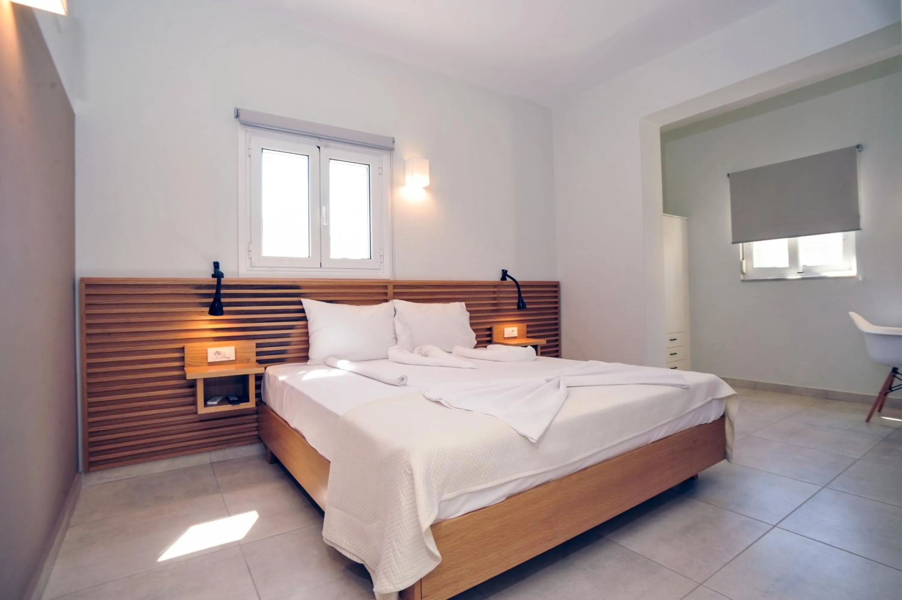 Bed in Mithos Premium Rooms