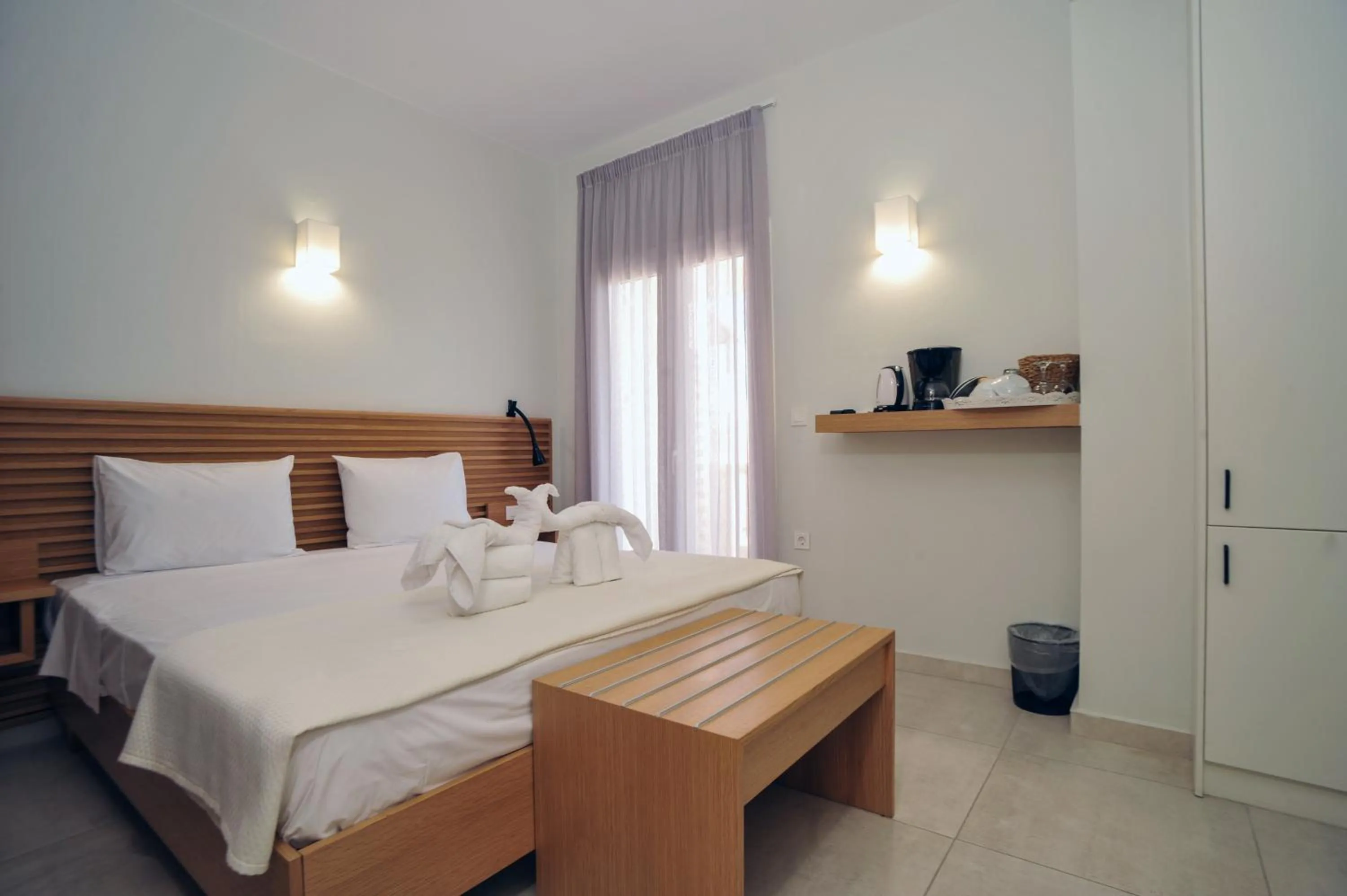 Bed in Mithos Premium Rooms