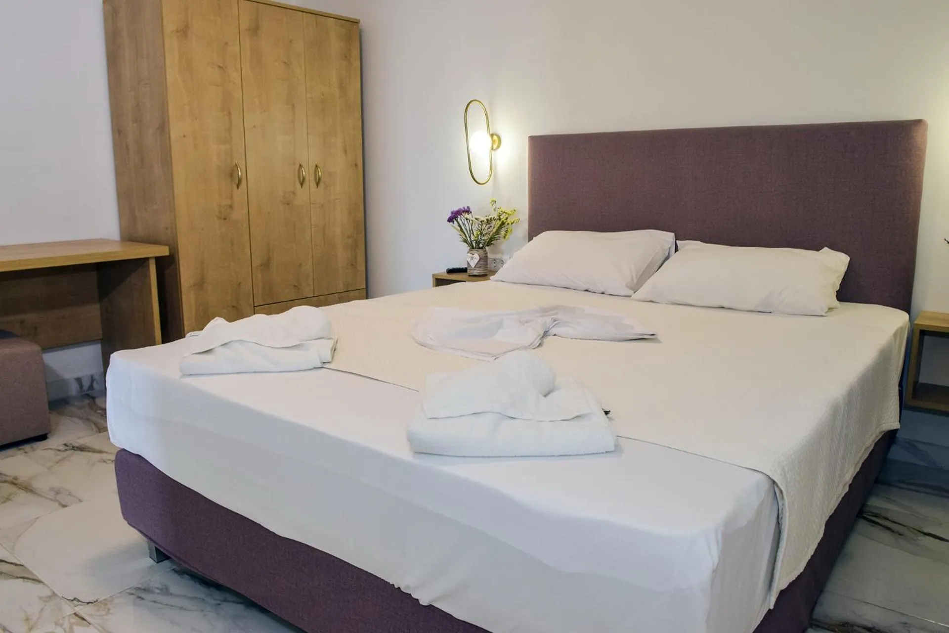 Bed in Mithos Premium Rooms