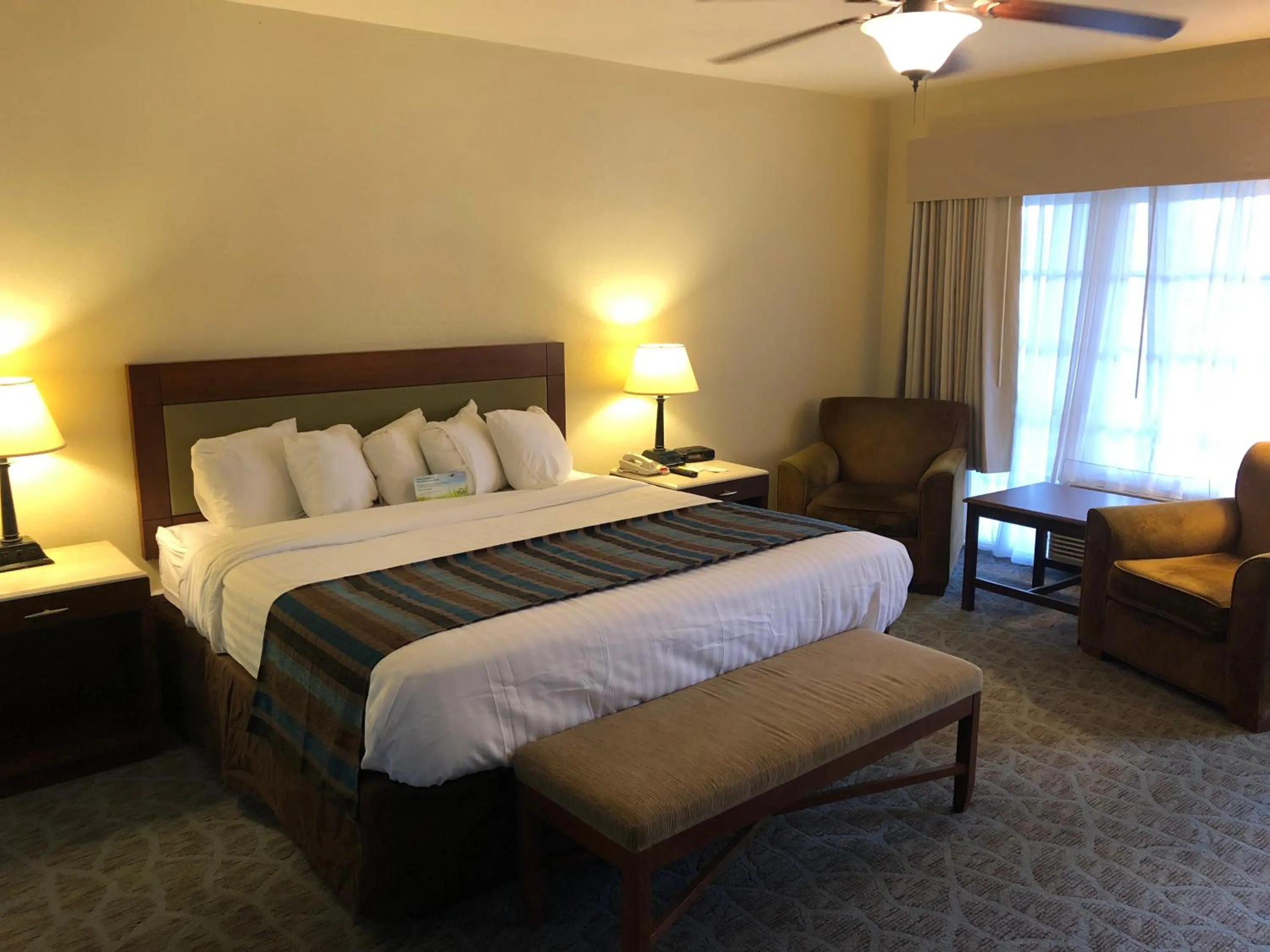 Seating area, Bed in Days Inn by Wyndham Natchez