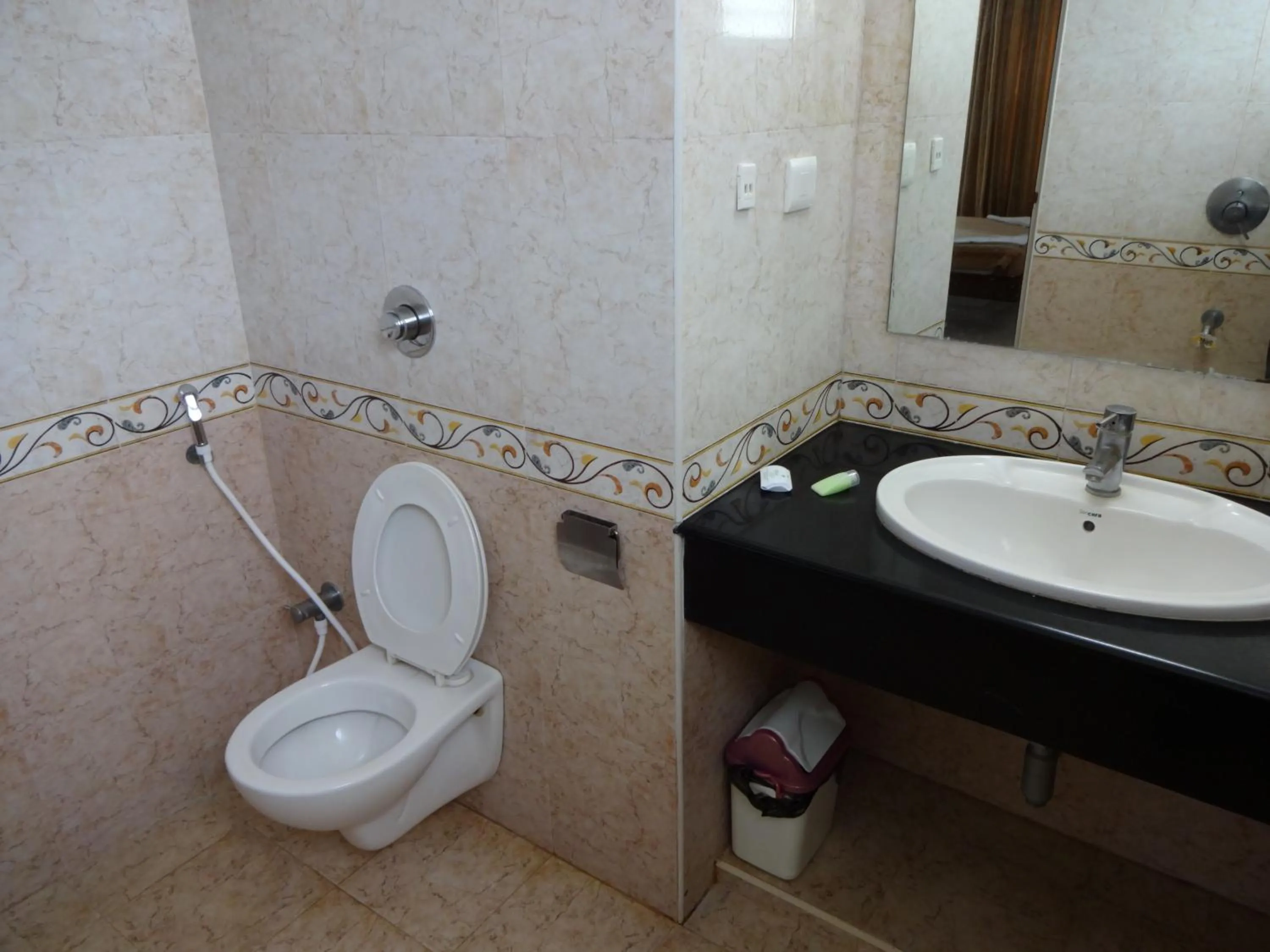 Bathroom in Lotus Comfort - A Pondy Hotel