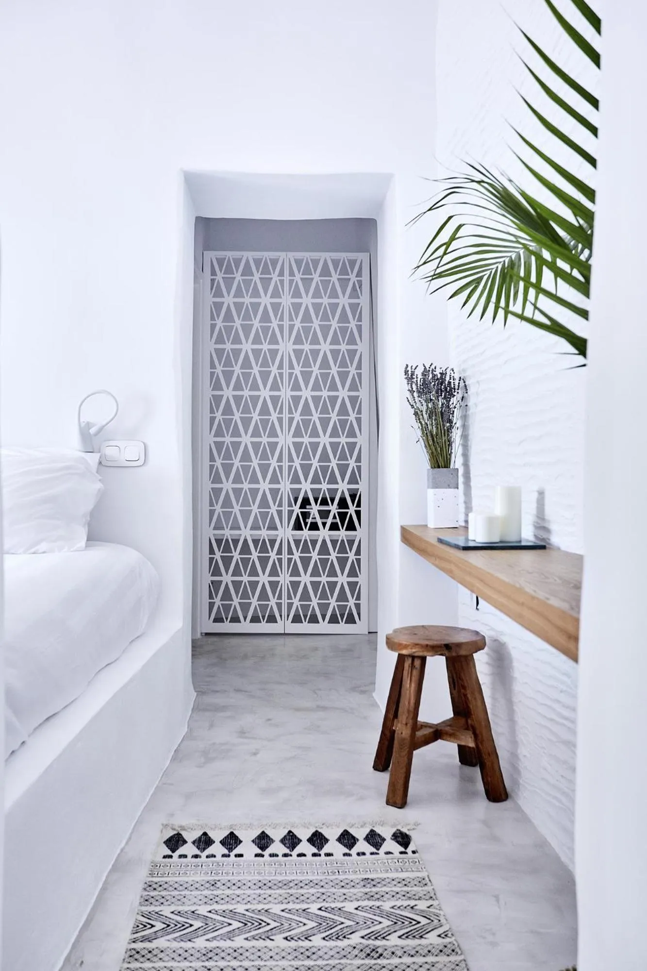 Bedroom in Living Theros Luxury Suites