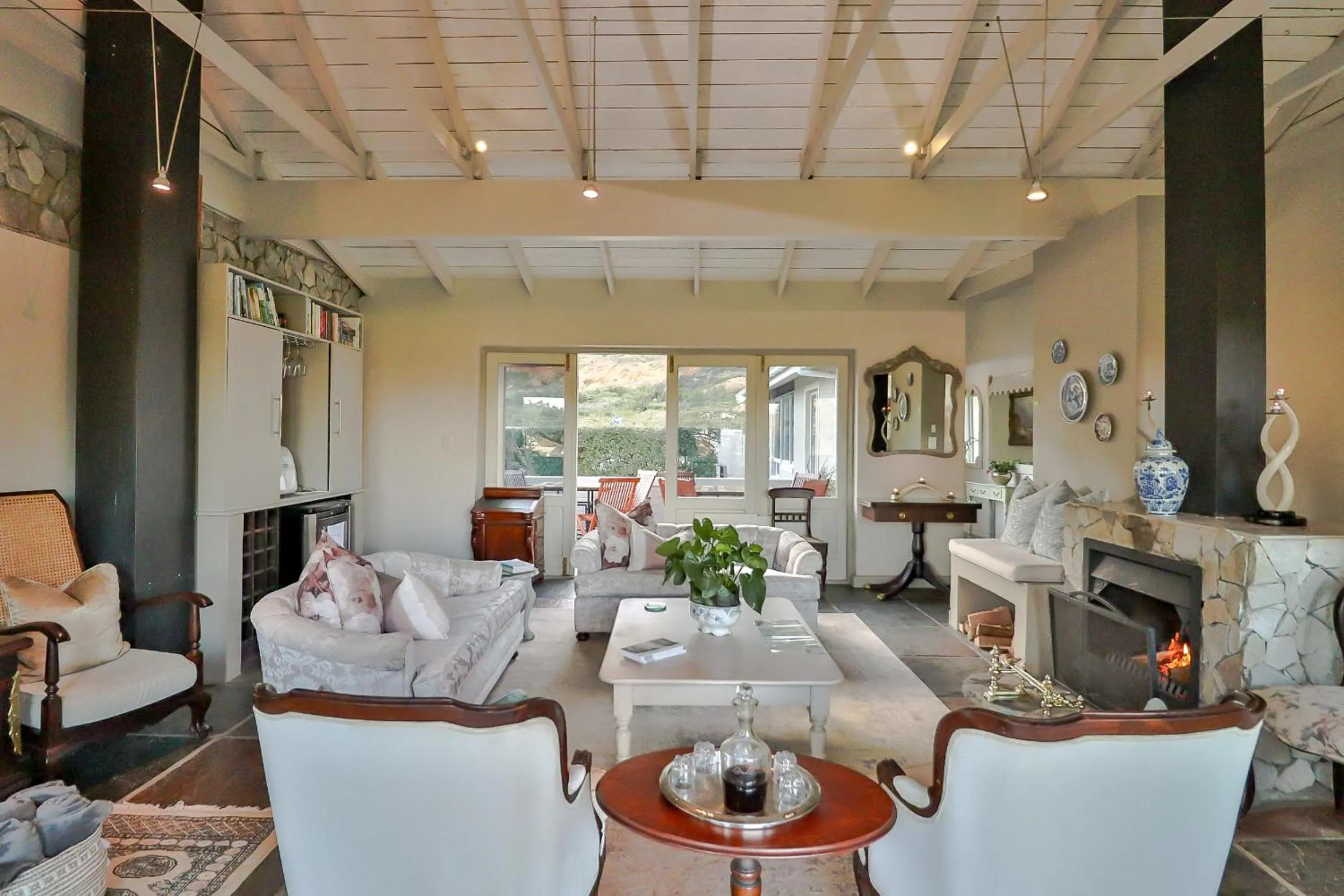 Communal lounge/ TV room in Hermanus Lodge on the Green - Solar Power