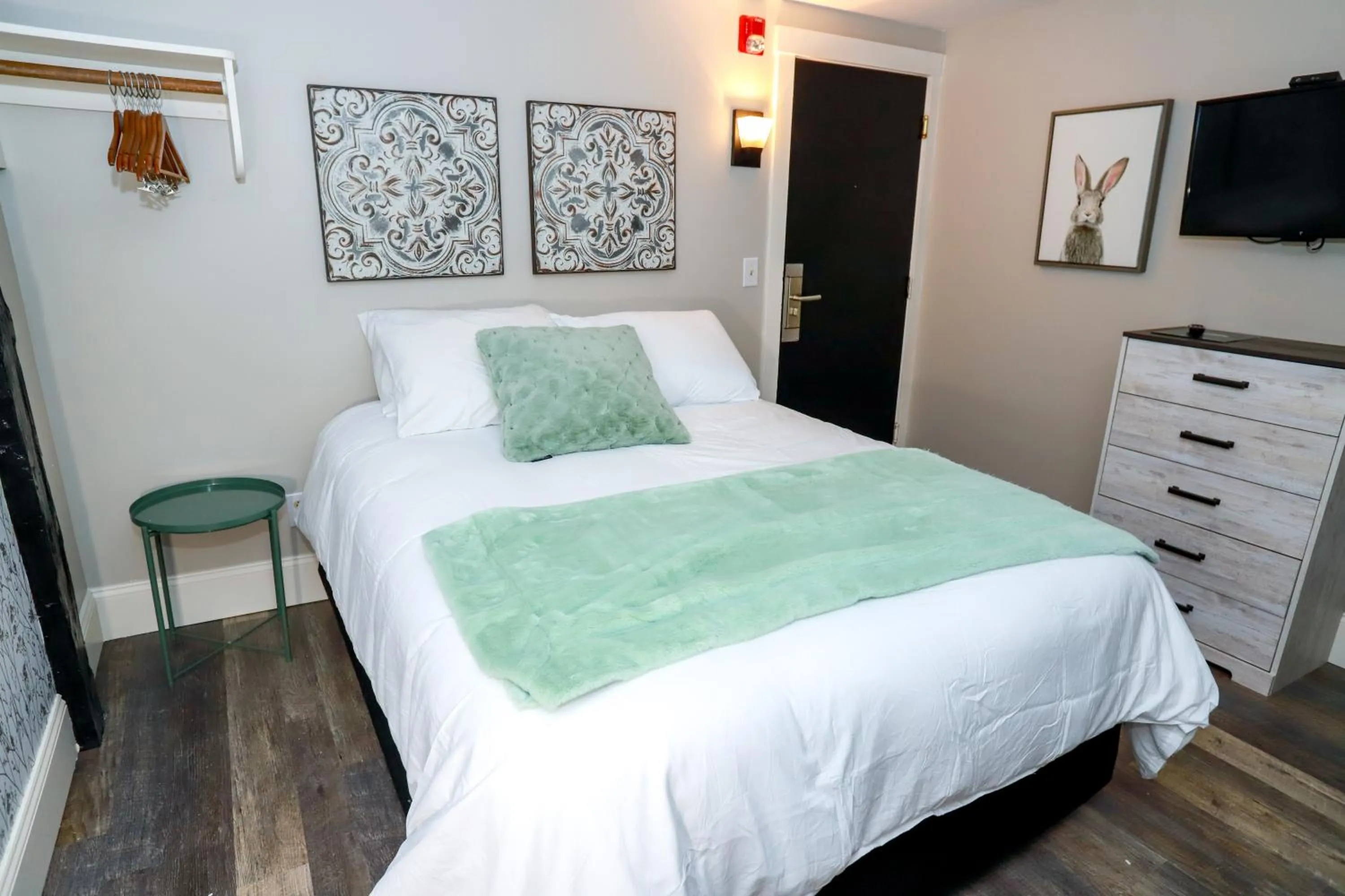 Bed in Gunstock Inn & Suites