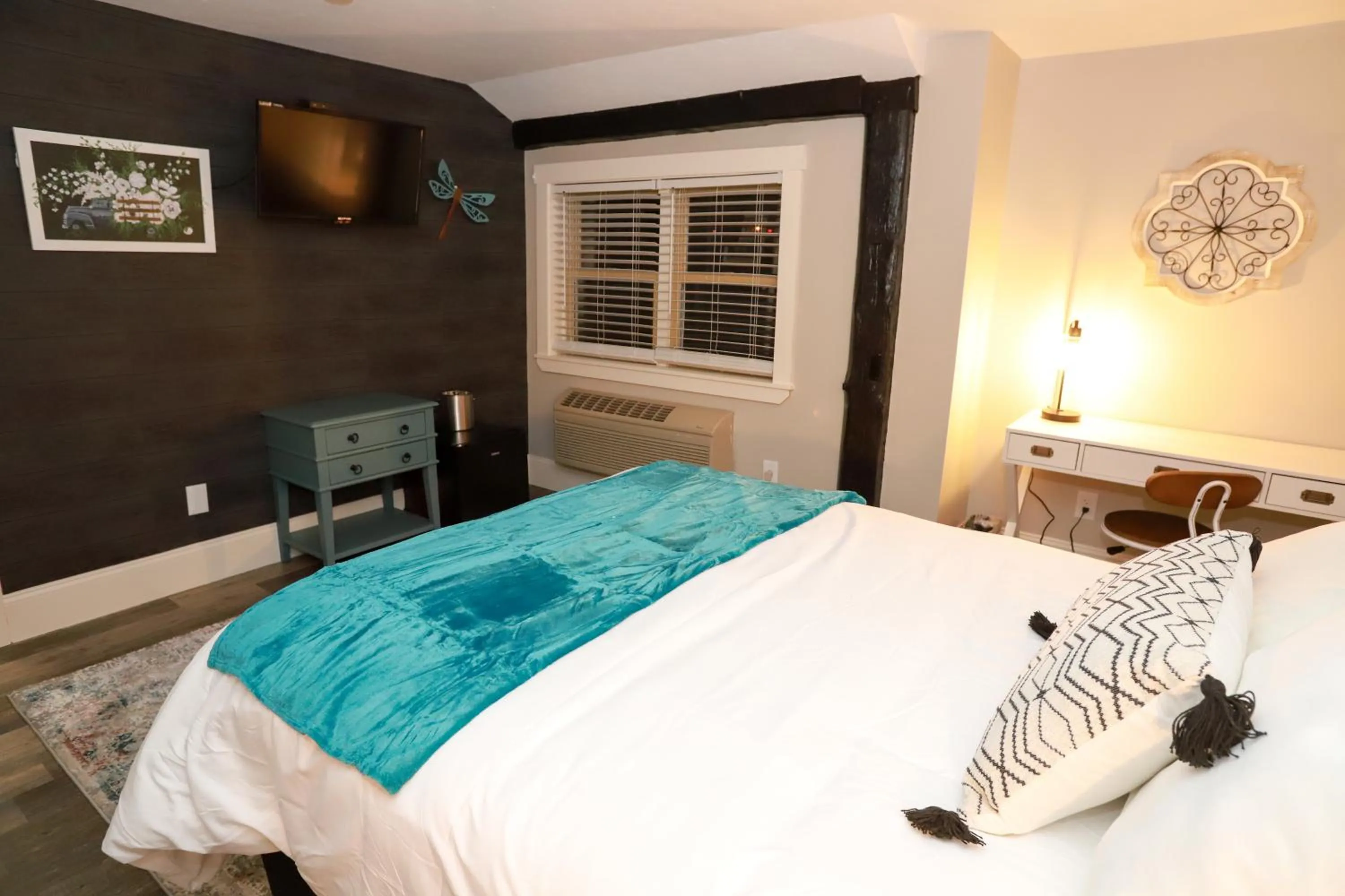 Bed in Gunstock Inn & Suites