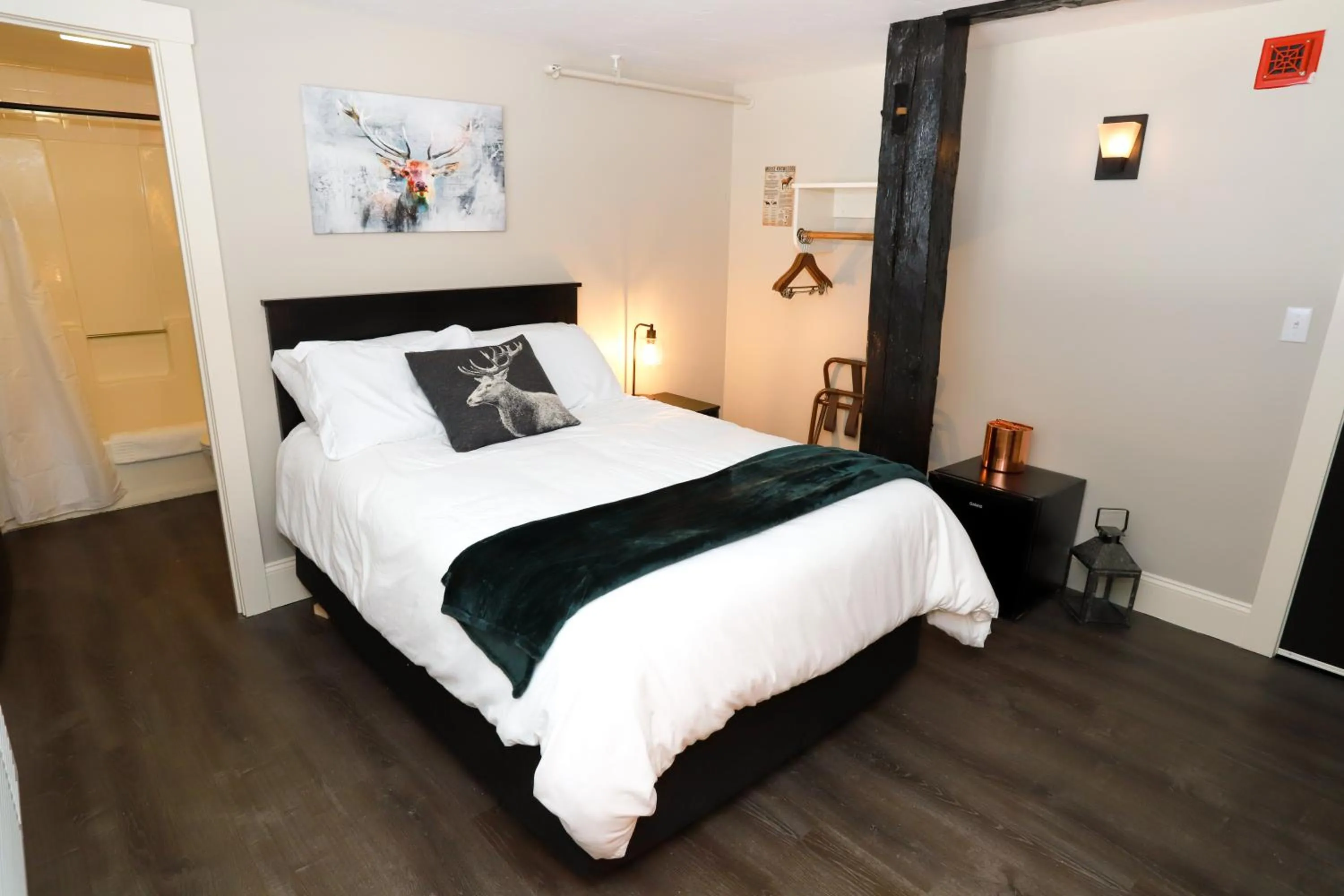 Bed in Gunstock Inn & Suites