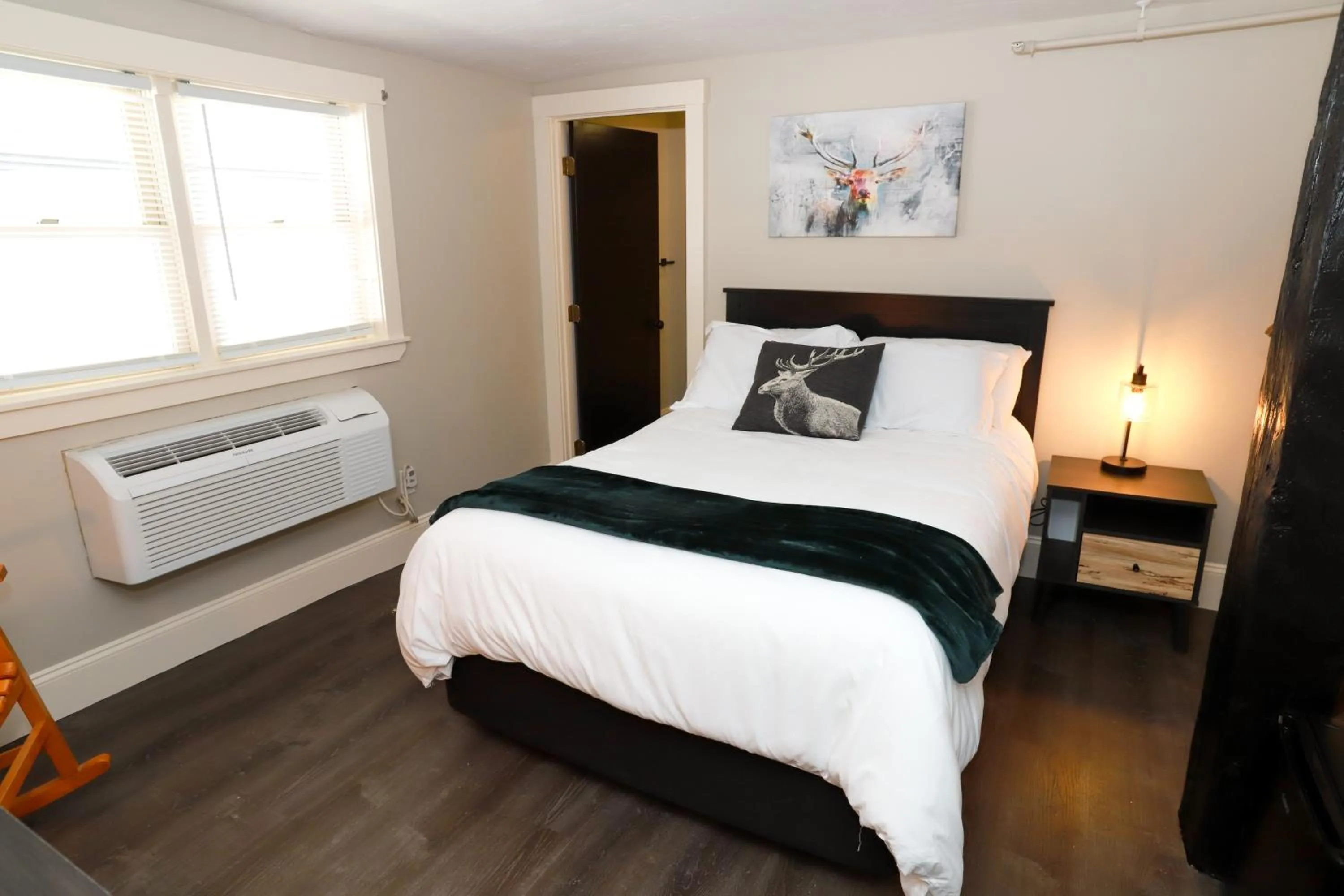 Bed in Gunstock Inn & Suites