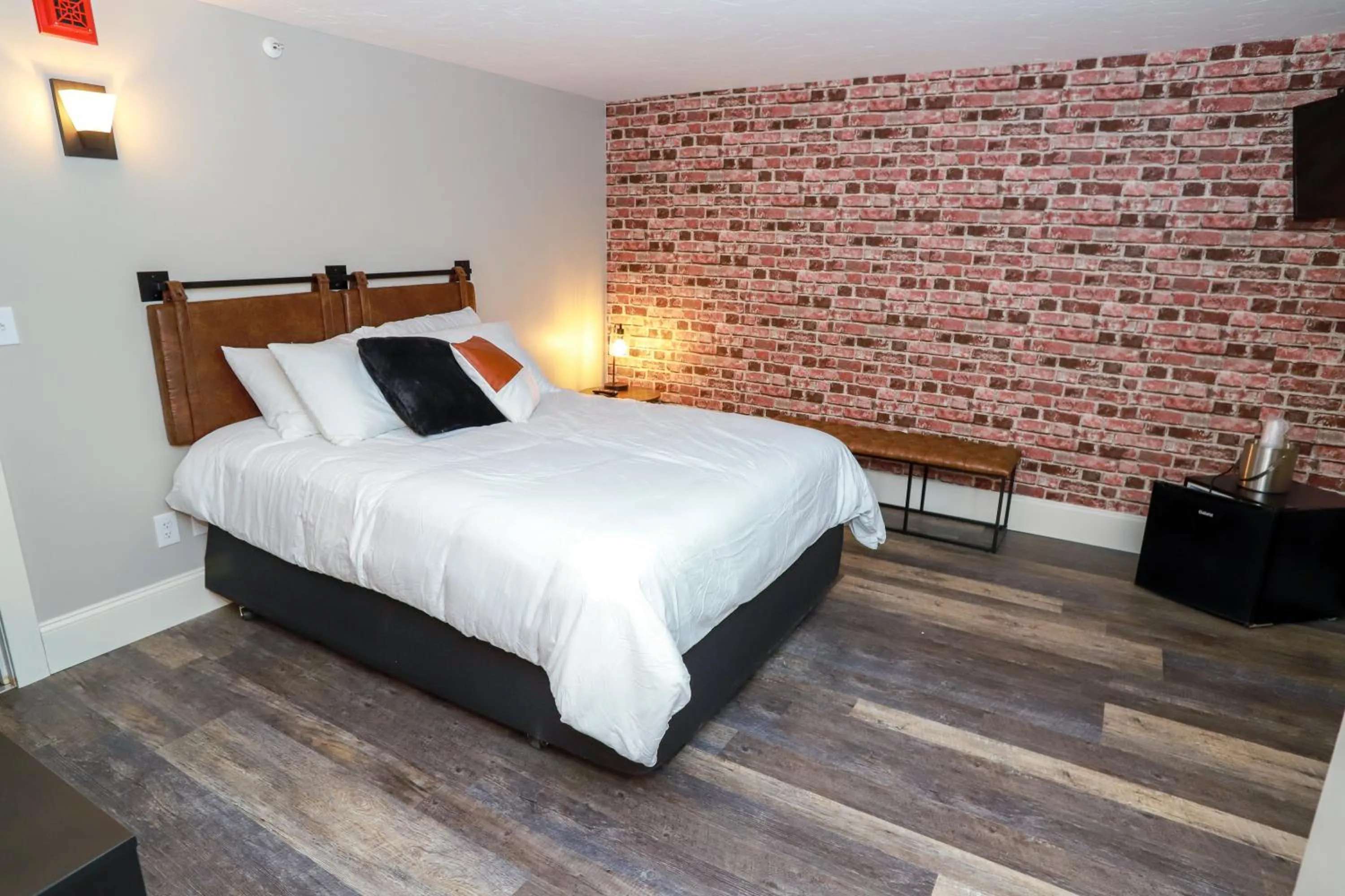 Bed in Gunstock Inn & Suites