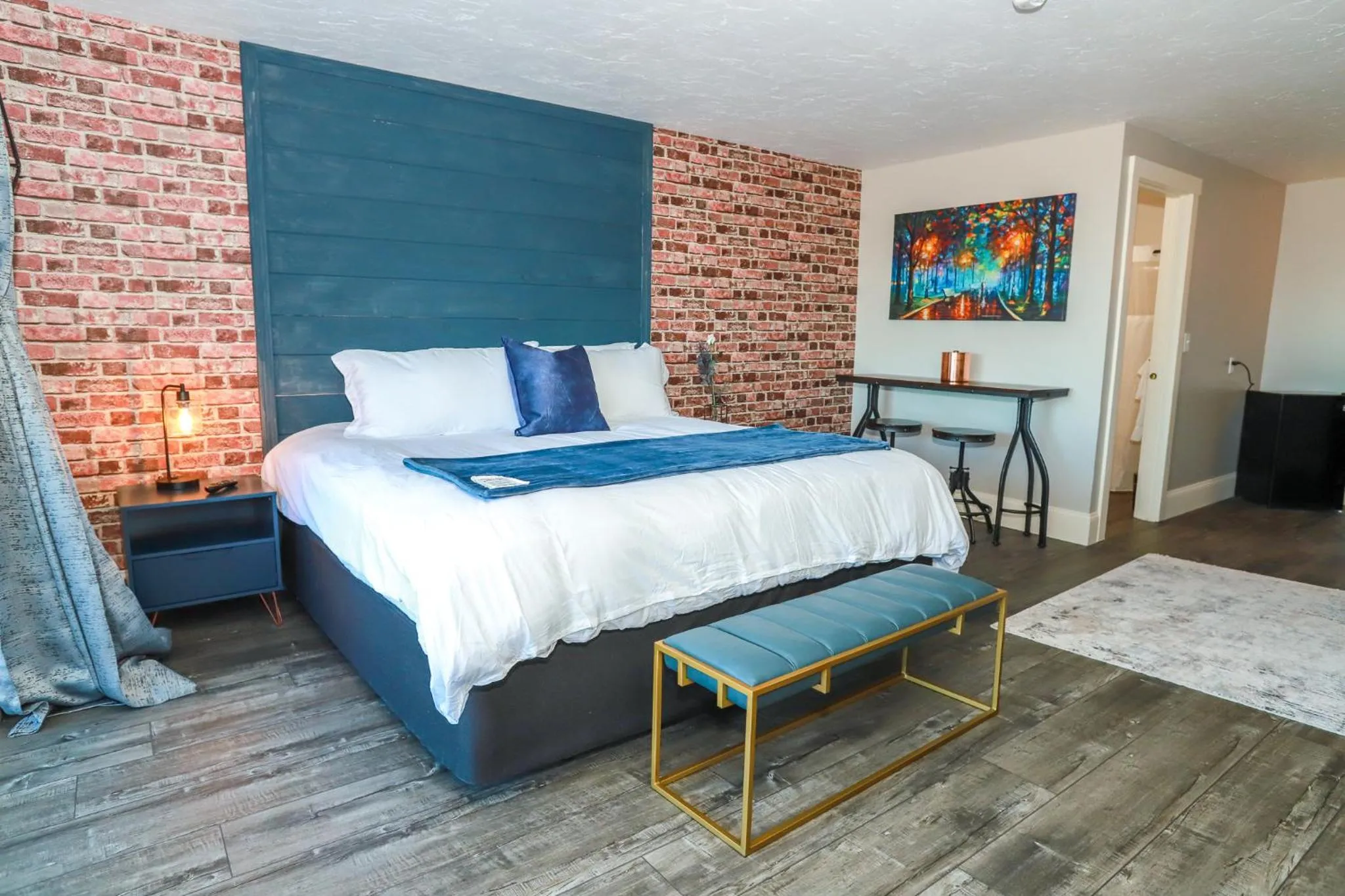 Bed in Gunstock Inn & Suites