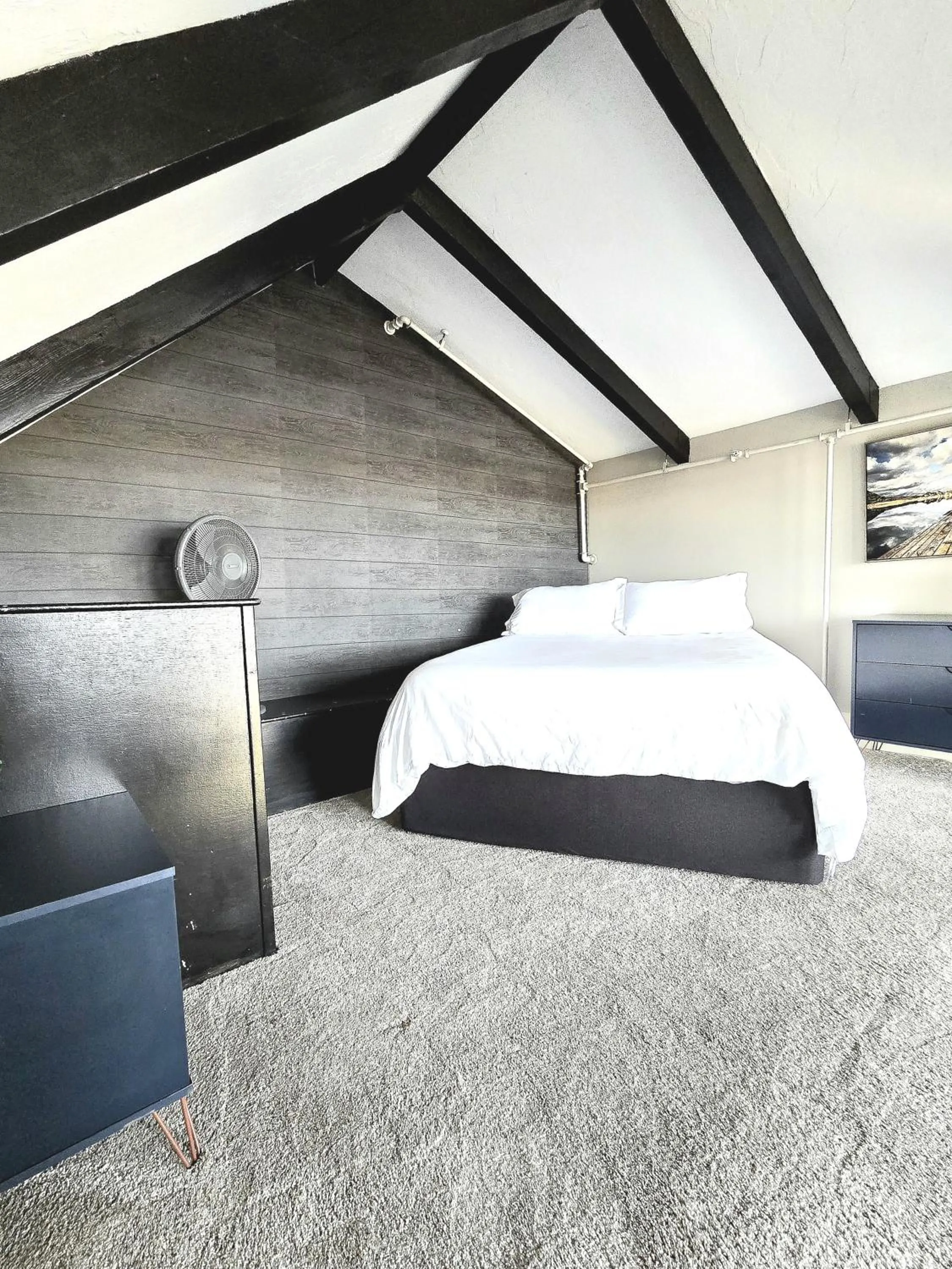 Bed in Gunstock Inn & Suites