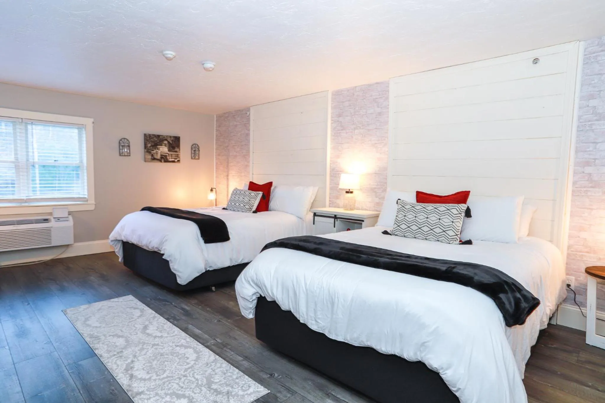 Bed in Gunstock Inn & Suites