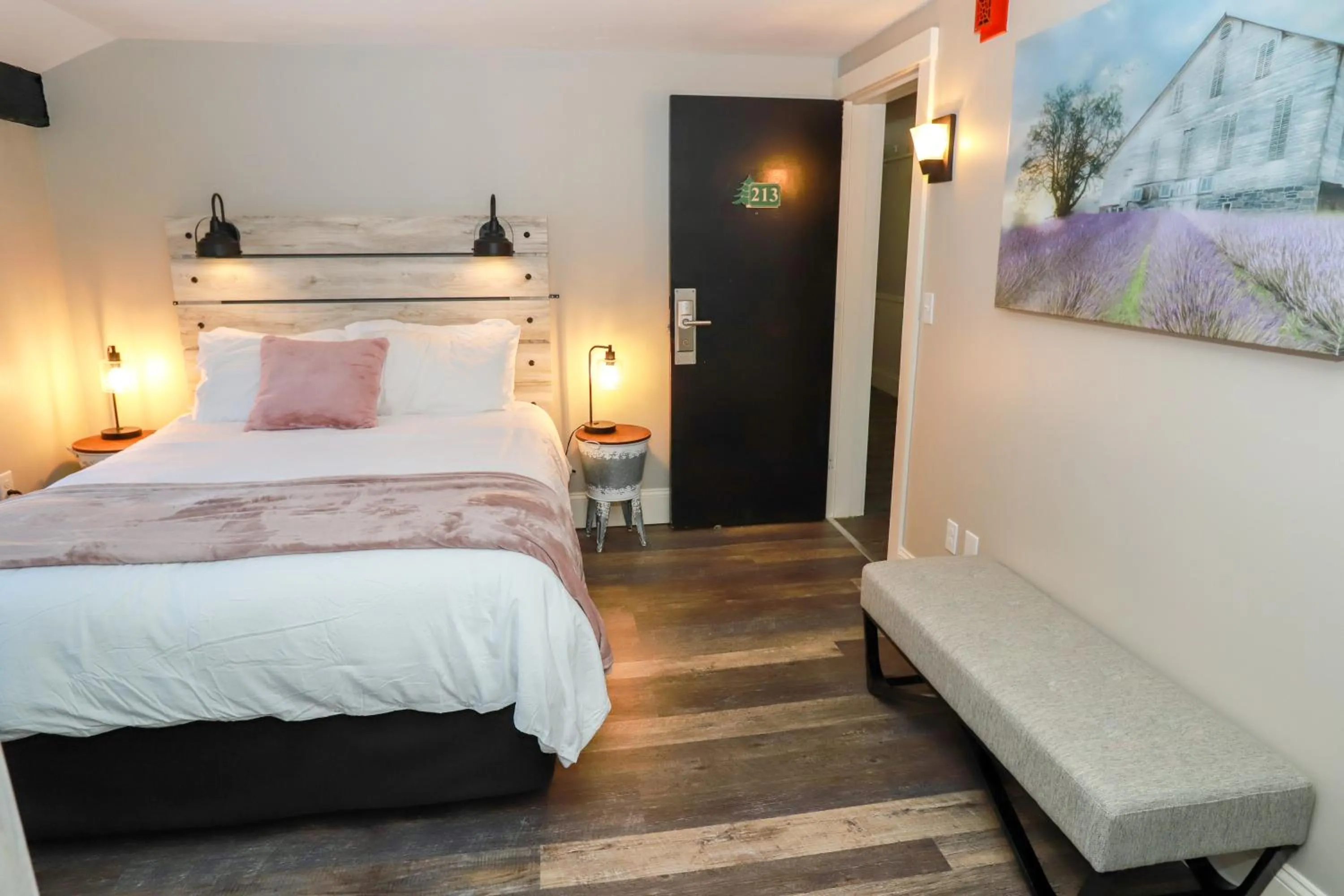 Bed in Gunstock Inn & Suites