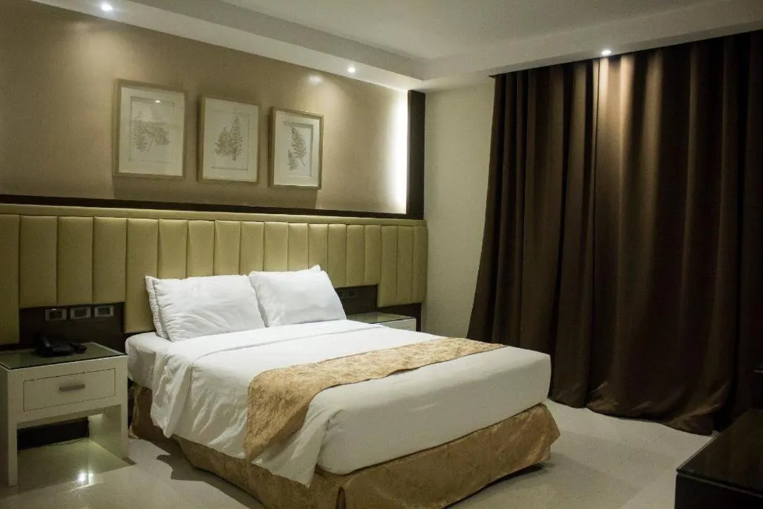 Bed in Crown Royale Hotel