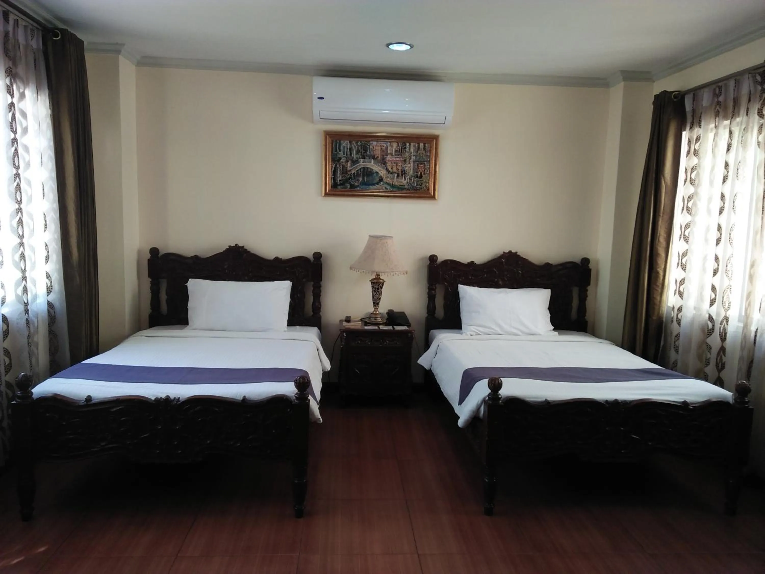 Bed in Crown Royale Hotel