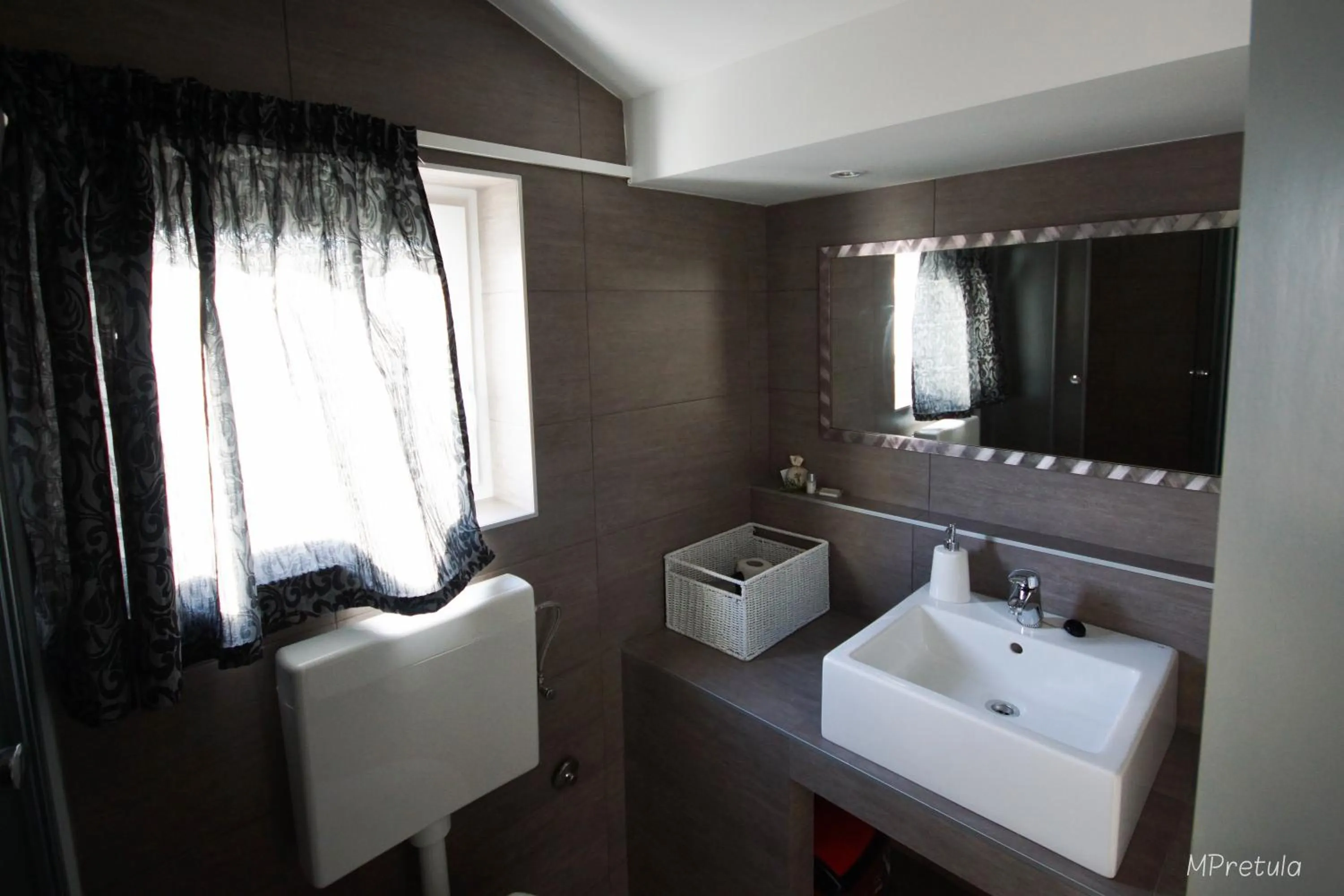 Bathroom in Apartments and Rooms Degra
