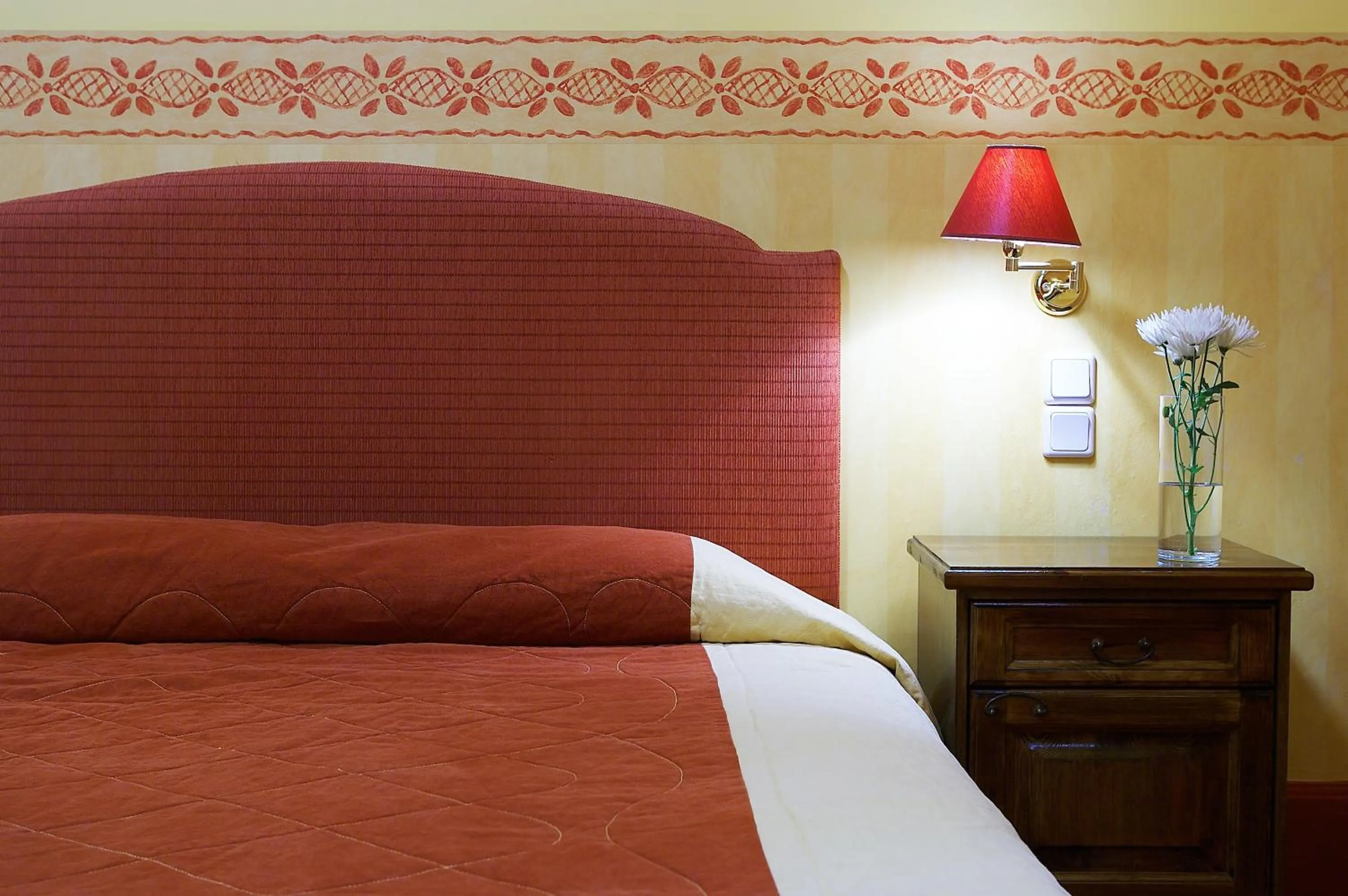 Bed in Country Club Hotel & Suites