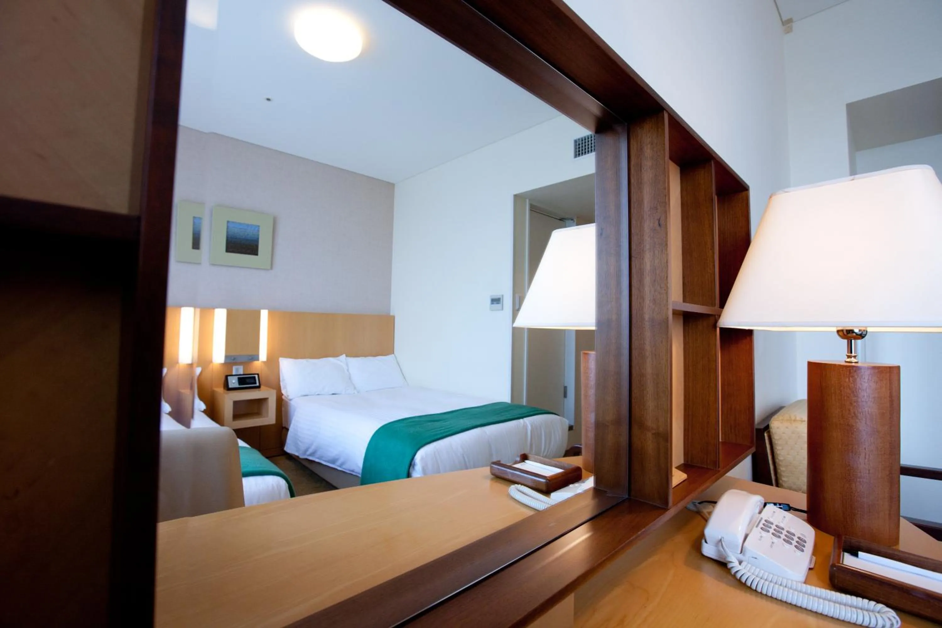 Bed in Hotel Kitano Plaza Rokkoso