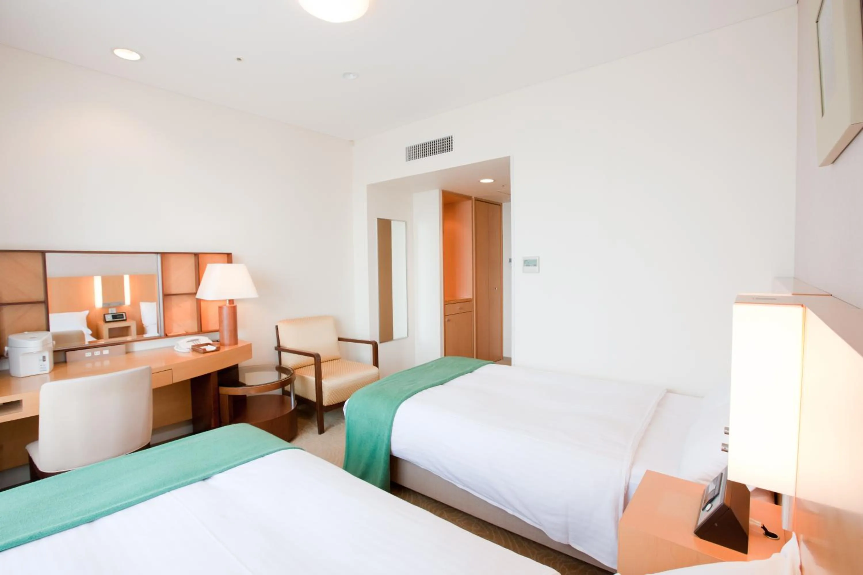 Bed in Hotel Kitano Plaza Rokkoso