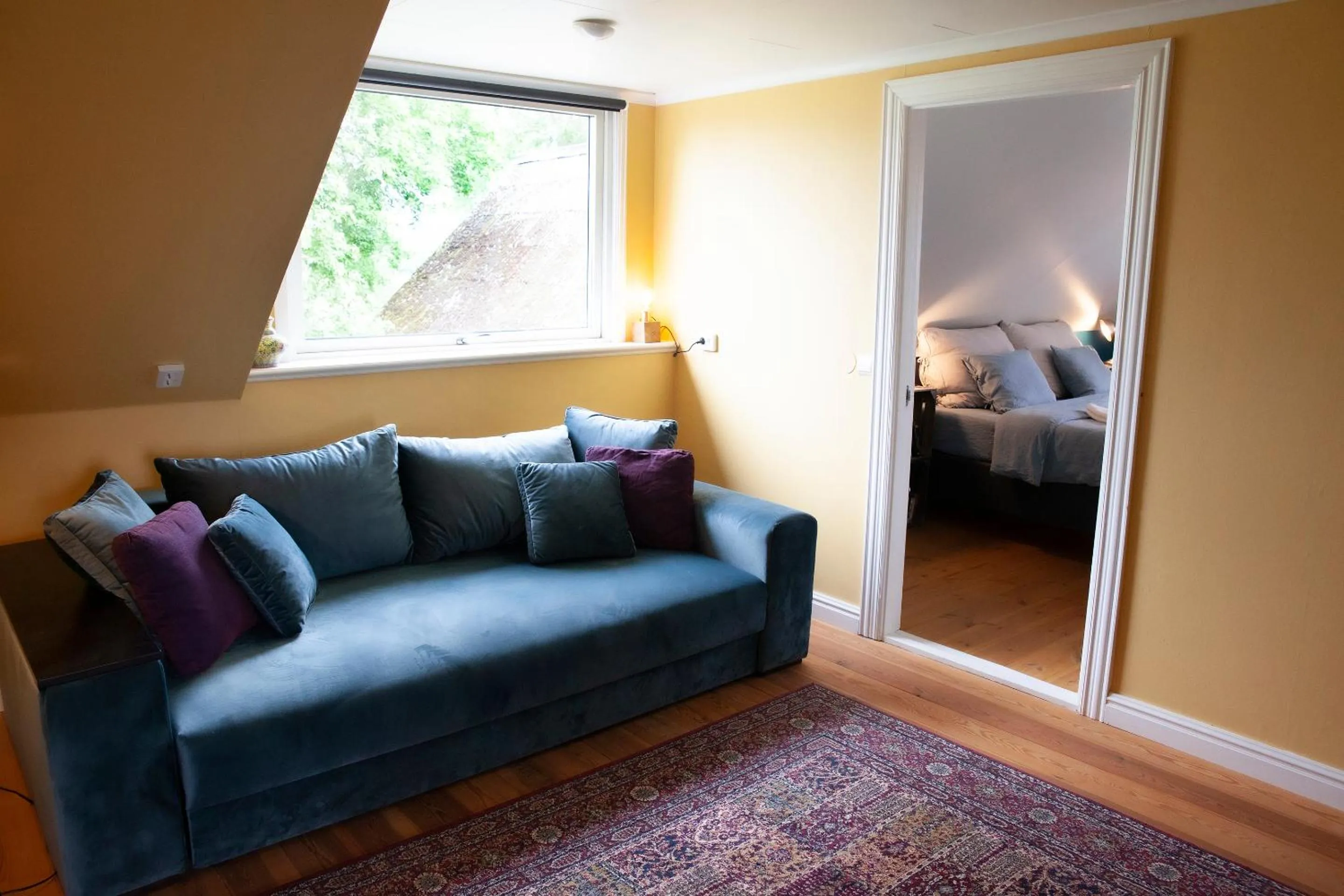 Seating area, Bed in Three Pheasants Boutique Bed and Breakfast