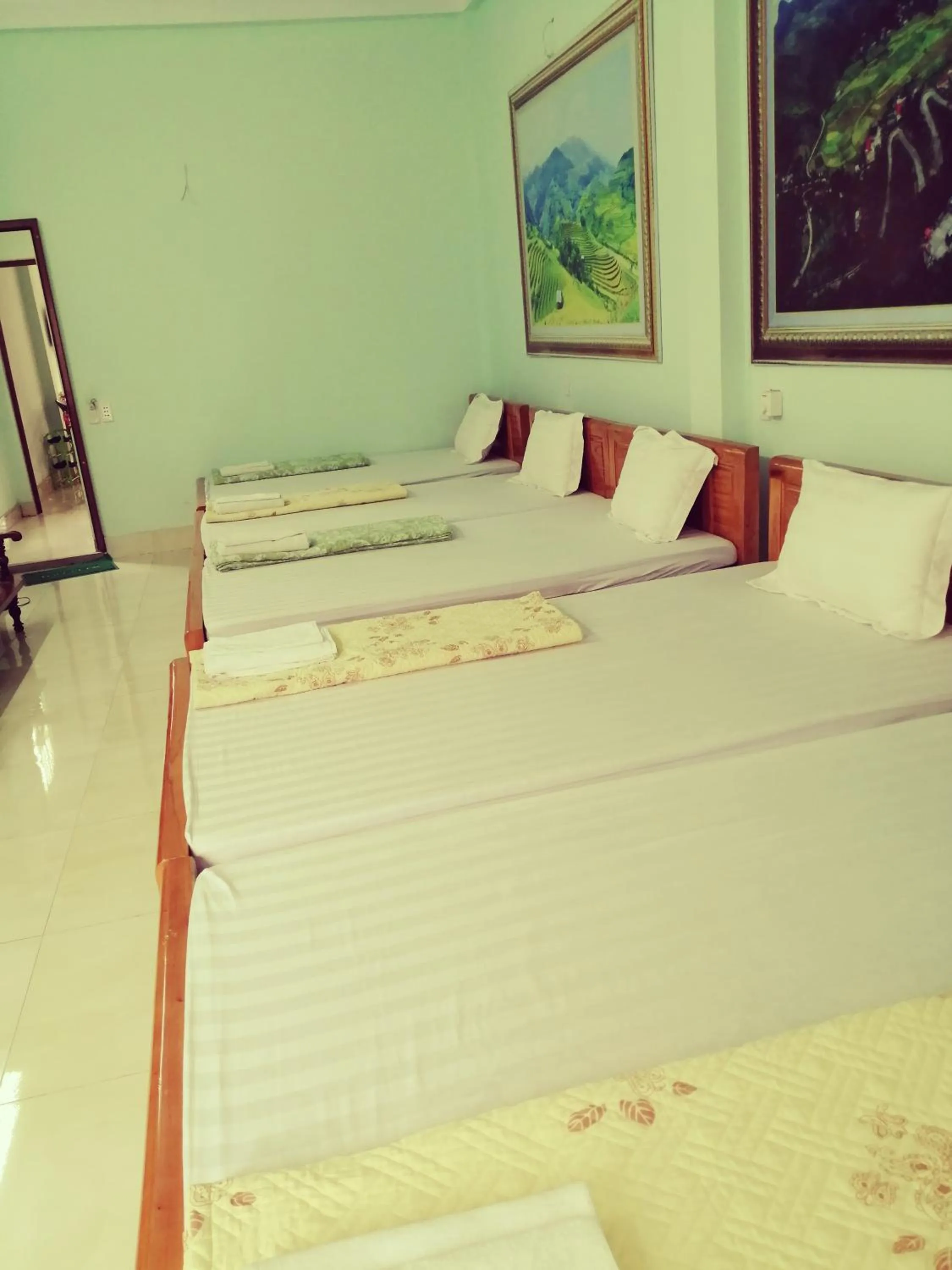 Bed in Yen Minh Hotel Thien An