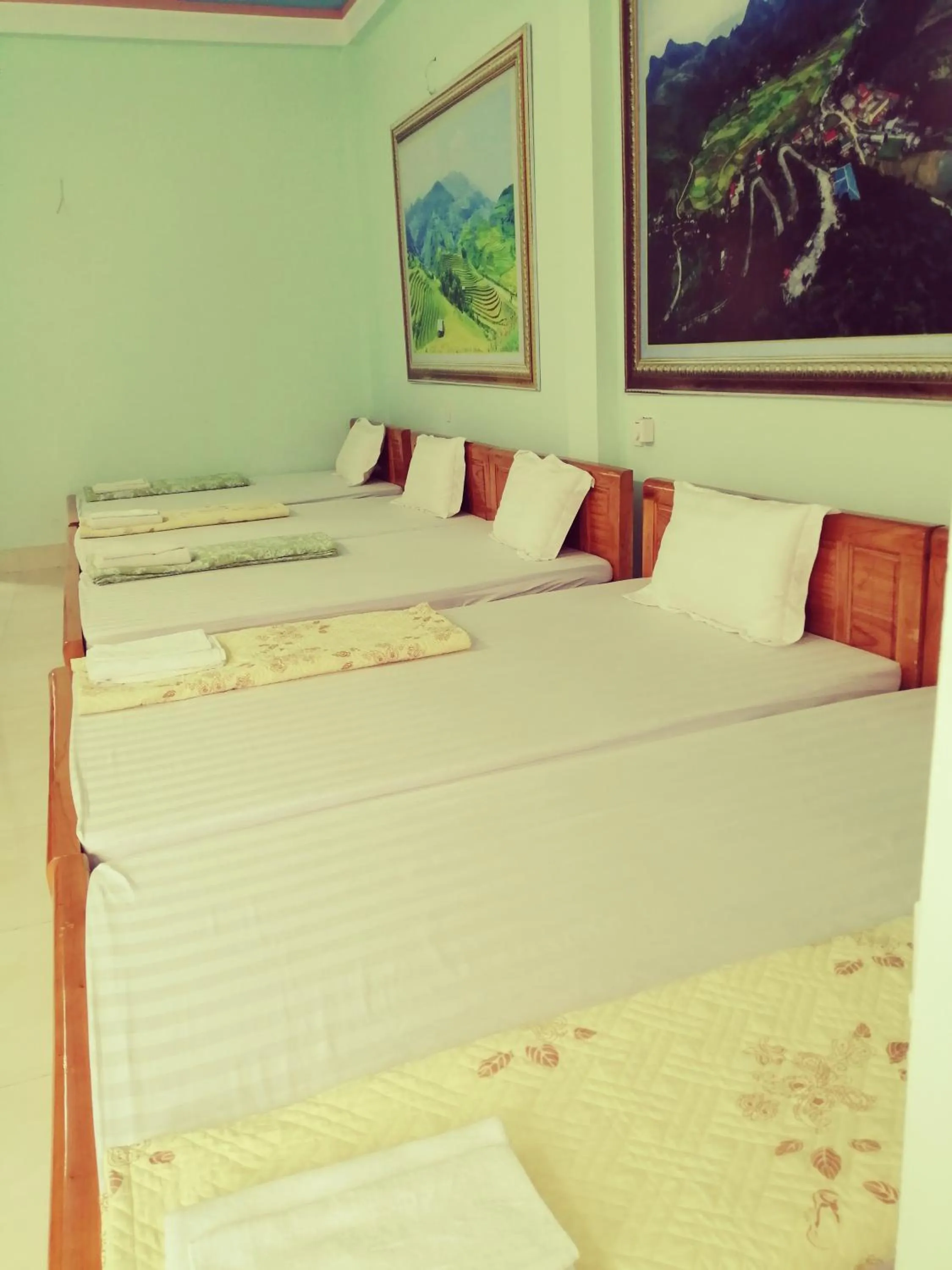 Bed in Yen Minh Hotel Thien An