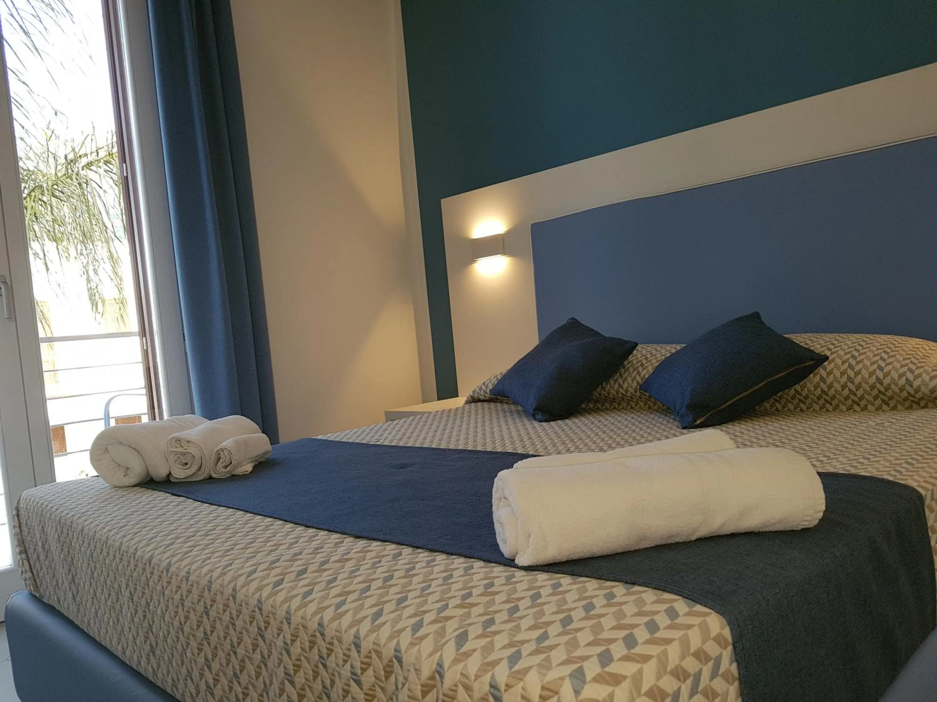 Bed in B&B Aloe Comfort Rooms