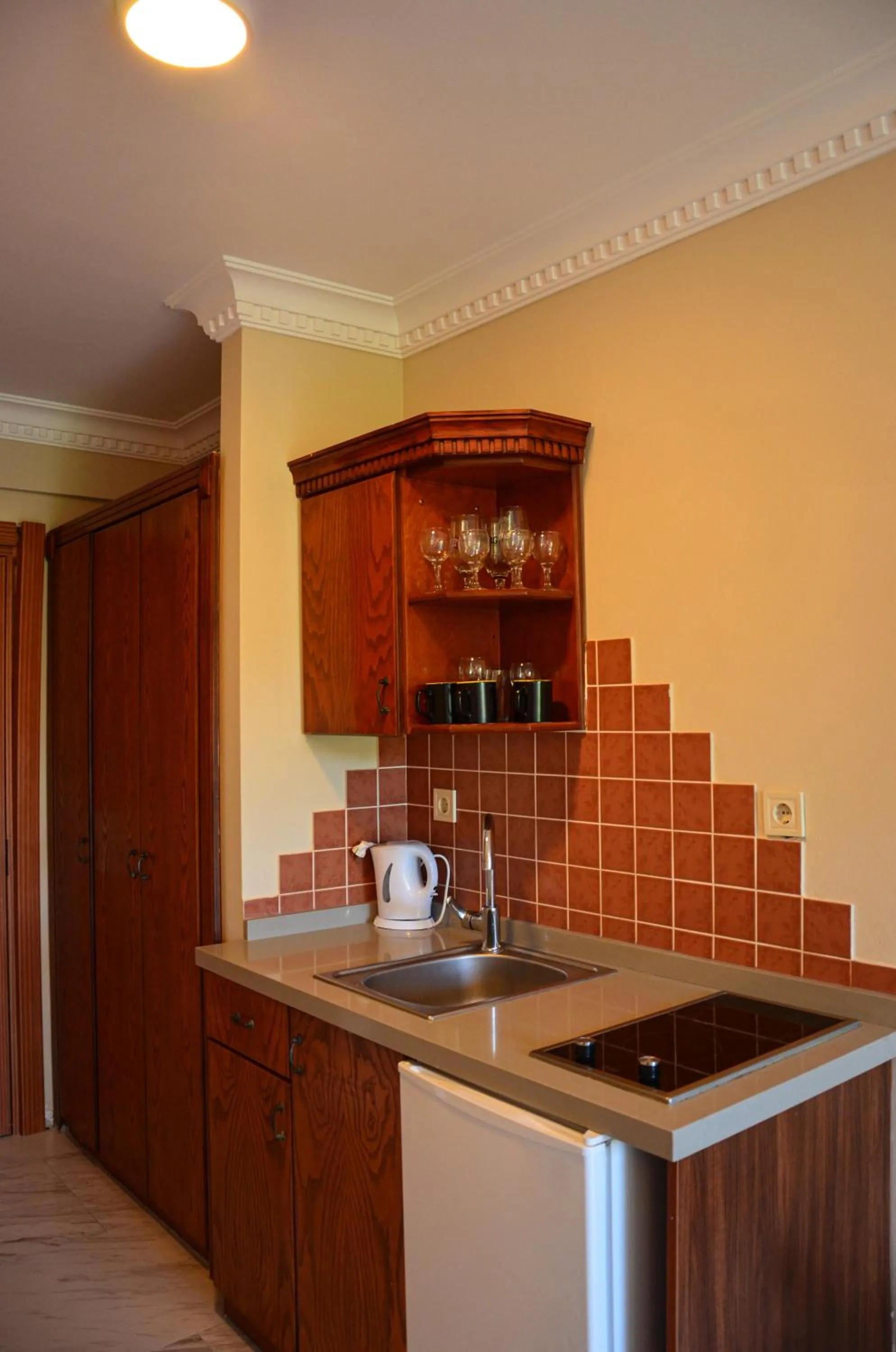 kitchen in Rosy Suites Hotel