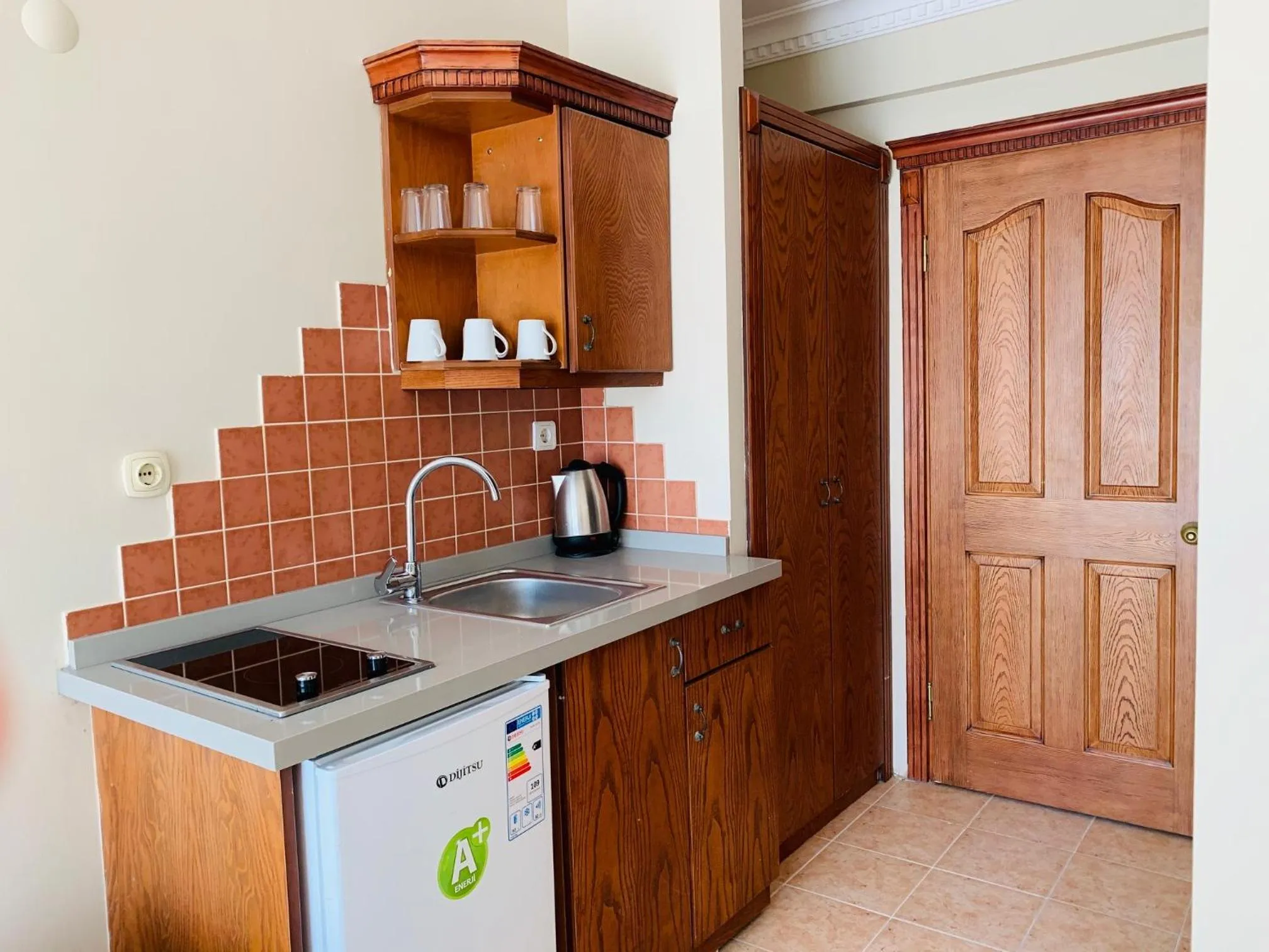 Kitchen or kitchenette in Rosy Suites Hotel