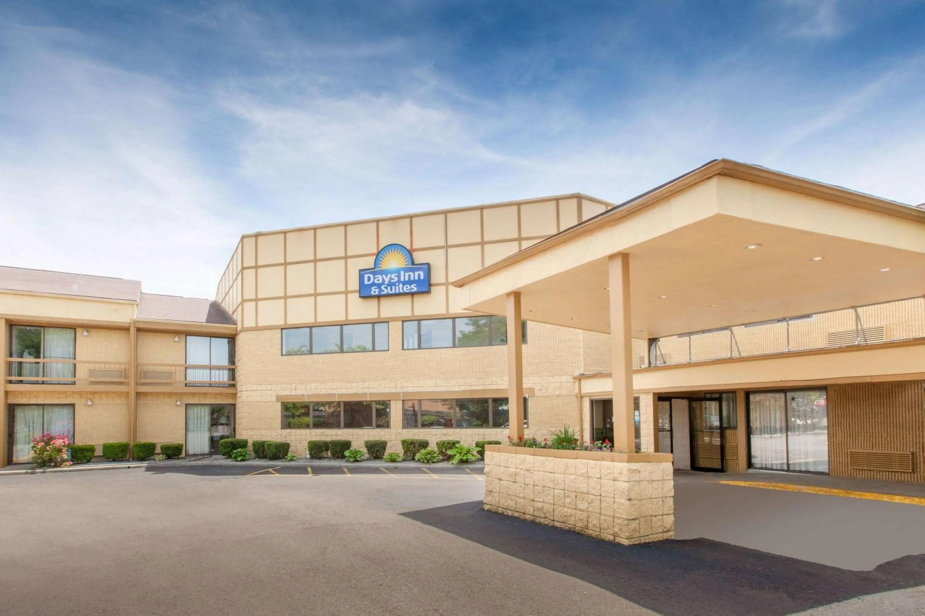 Property building in Days Inn & Suites by Wyndham Madison Heights MI