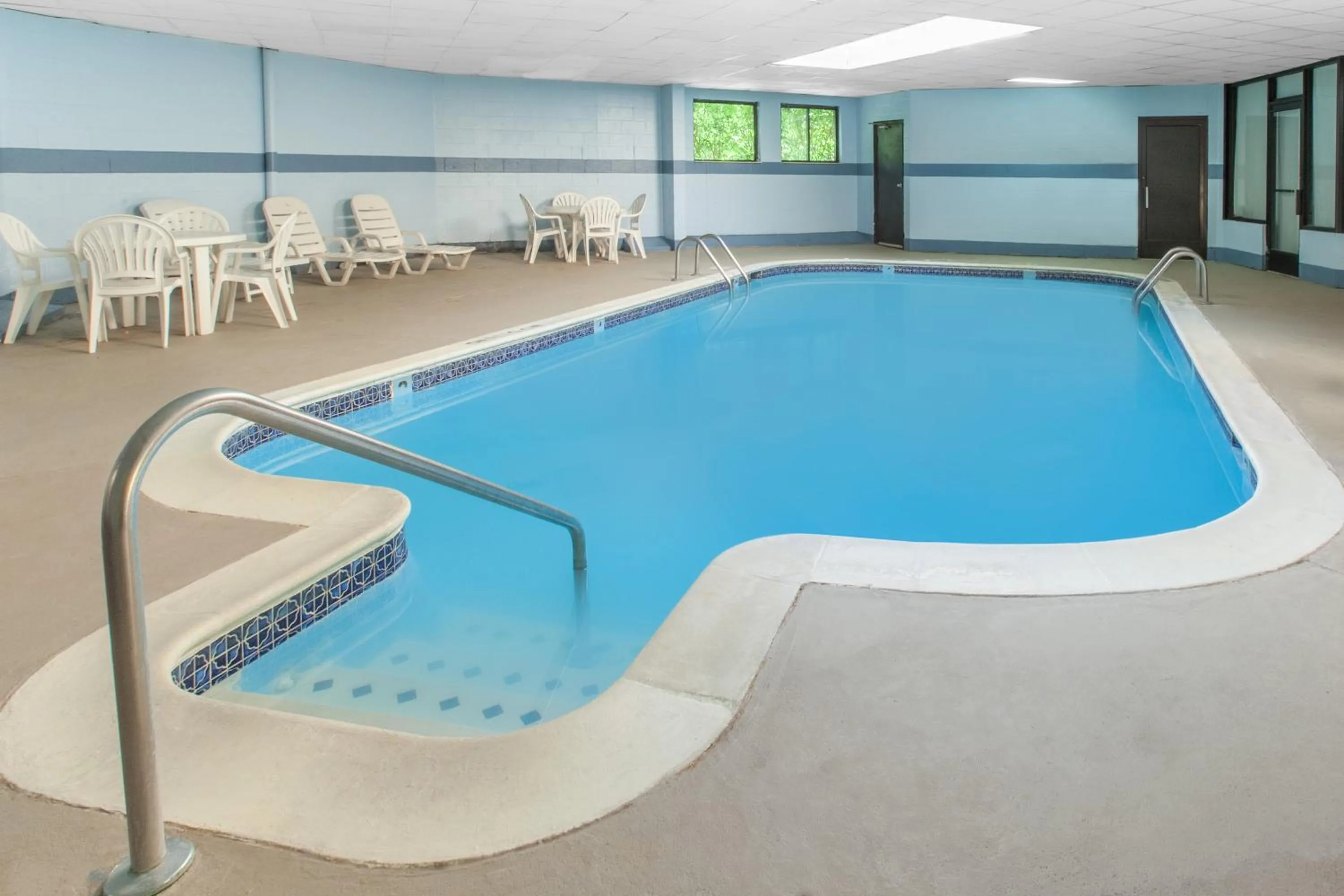Swimming pool in Days Inn & Suites by Wyndham Madison Heights MI