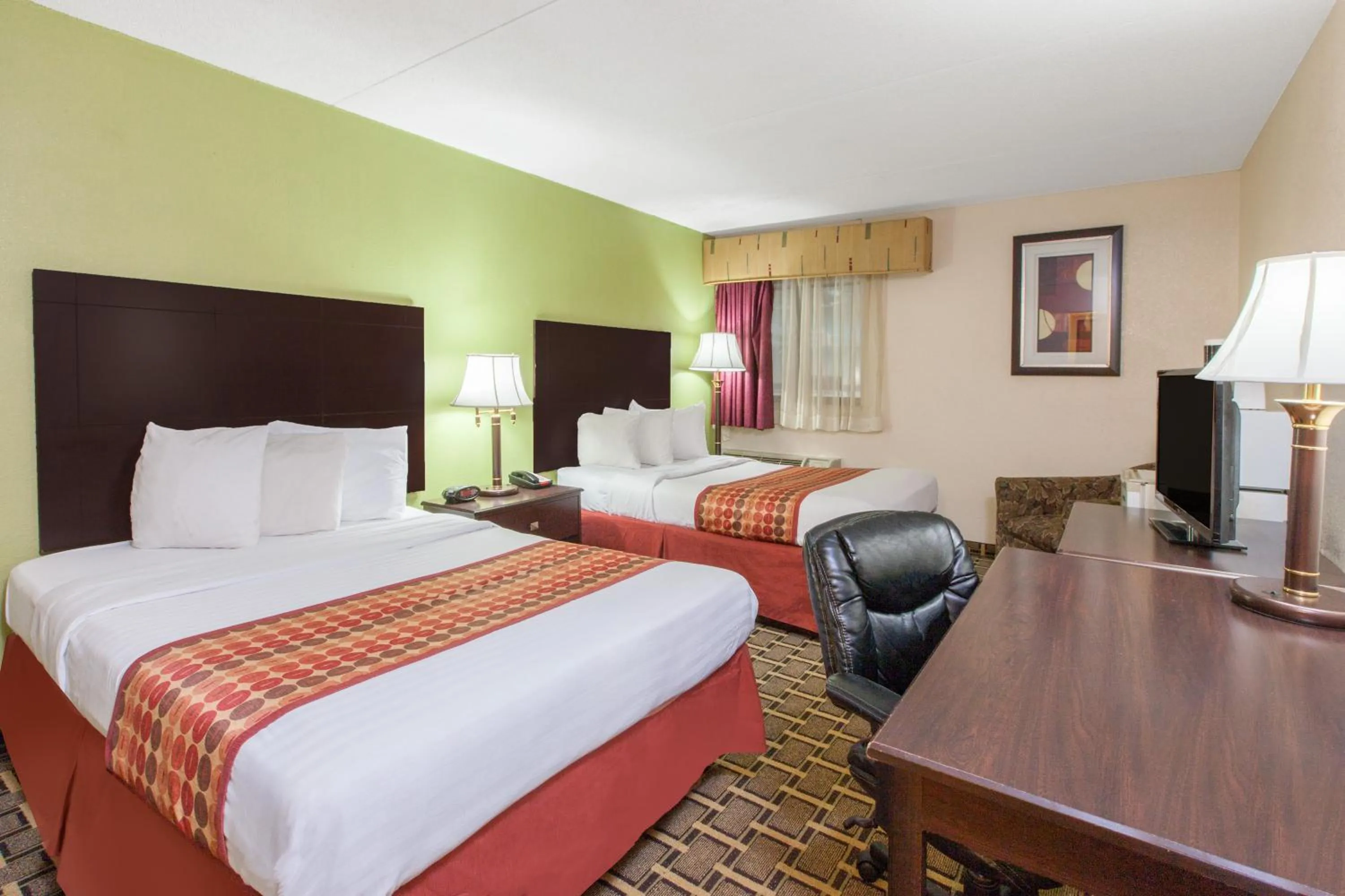 TV and multimedia, Bed in Days Inn & Suites by Wyndham Madison Heights MI