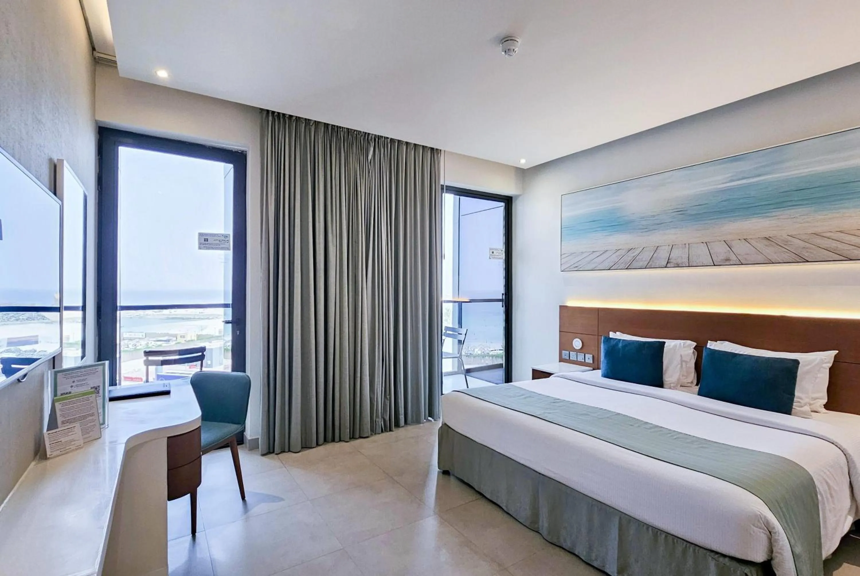 Photo of the whole room, Bed in Wyndham Garden Ajman Corniche
