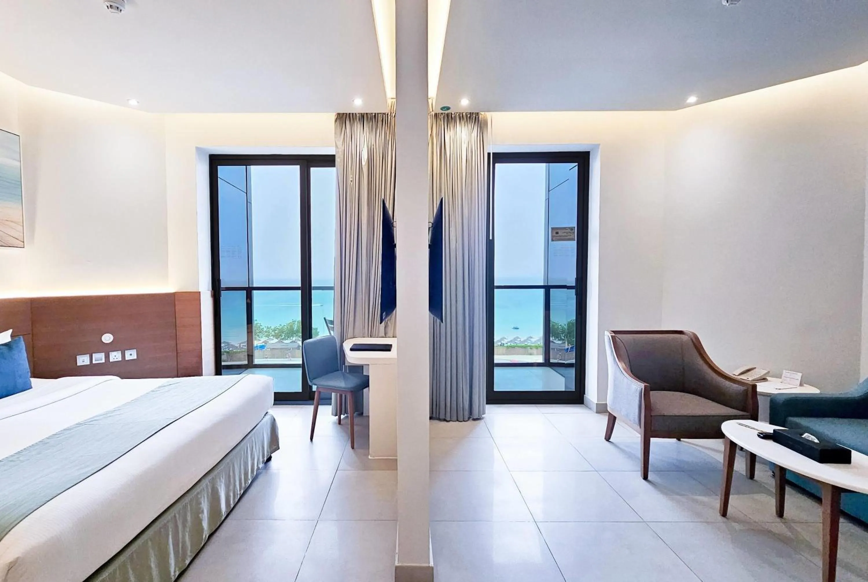 Photo of the whole room, Bed in Wyndham Garden Ajman Corniche