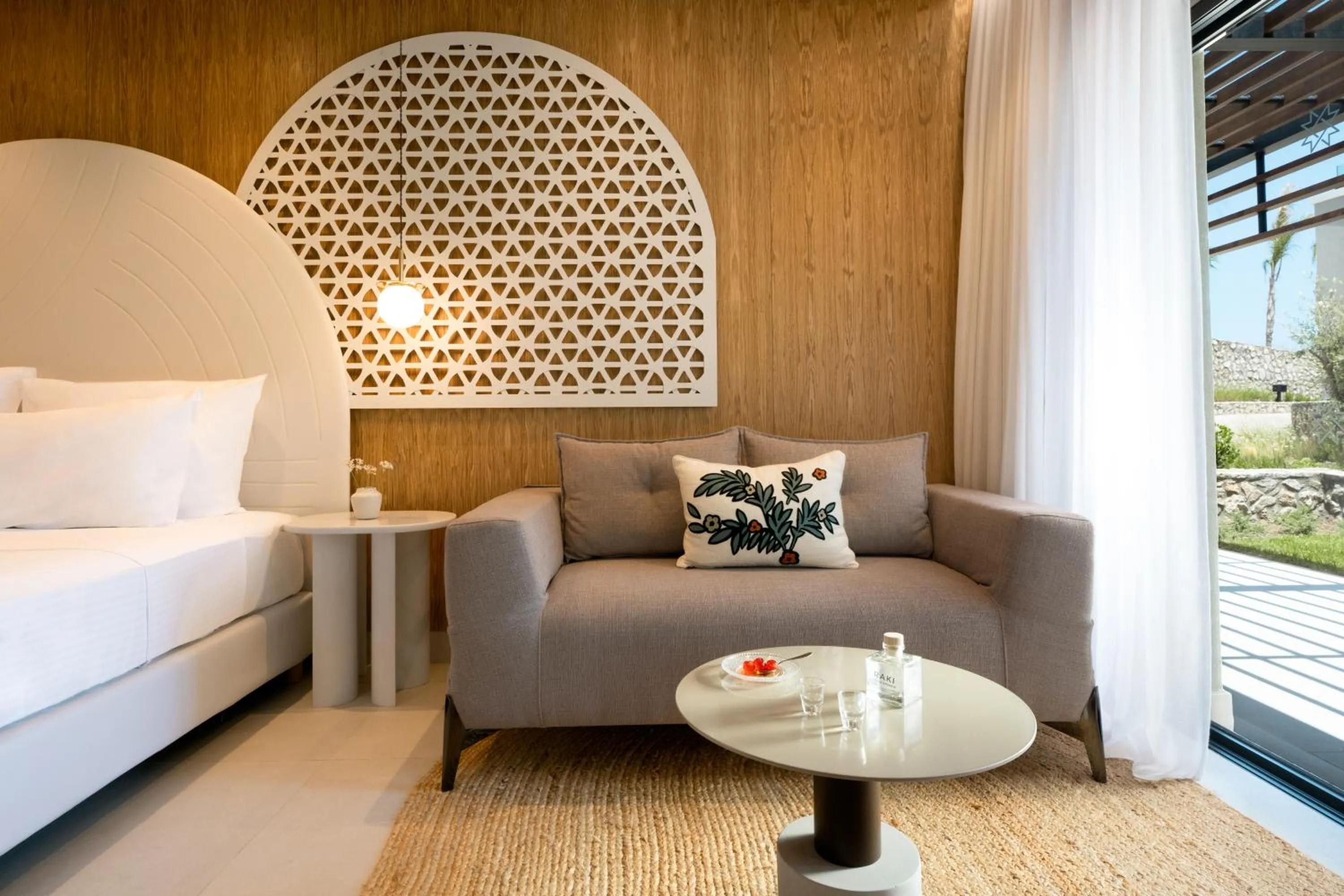 Seating area, Bed in Mitsis Rodos Village