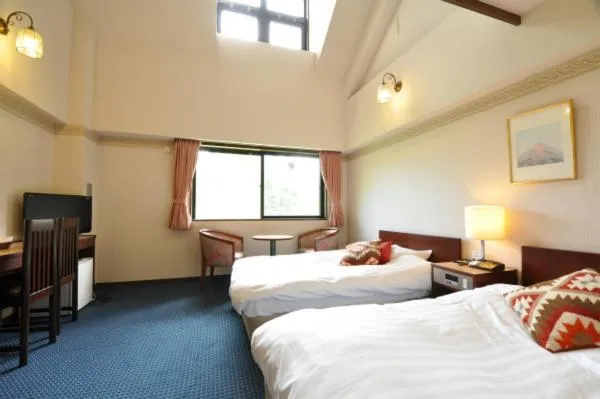 Bed in Hakuba Yamano Hotel