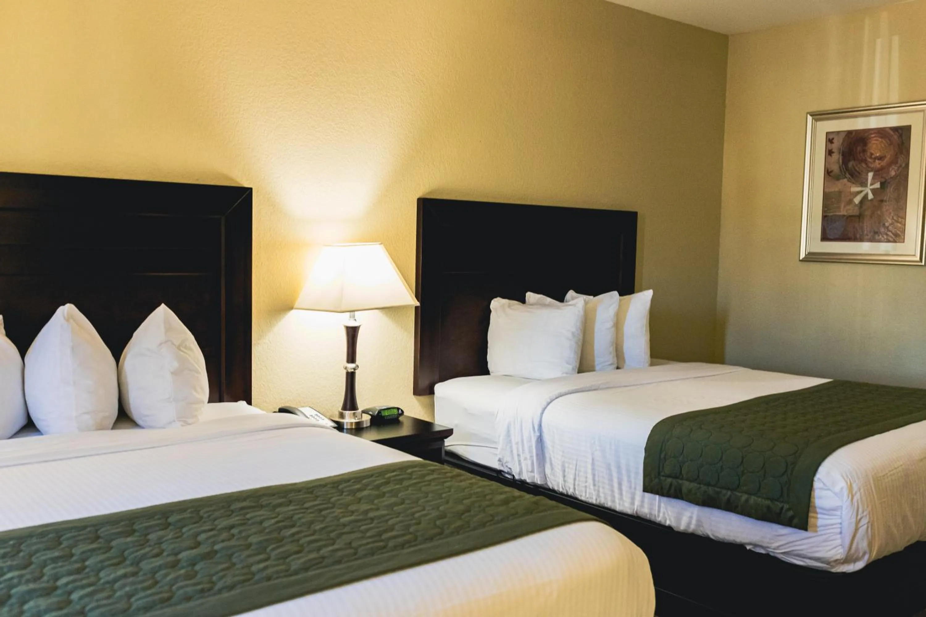 Bedroom, Bed in Grander Inn & Suites by IHG