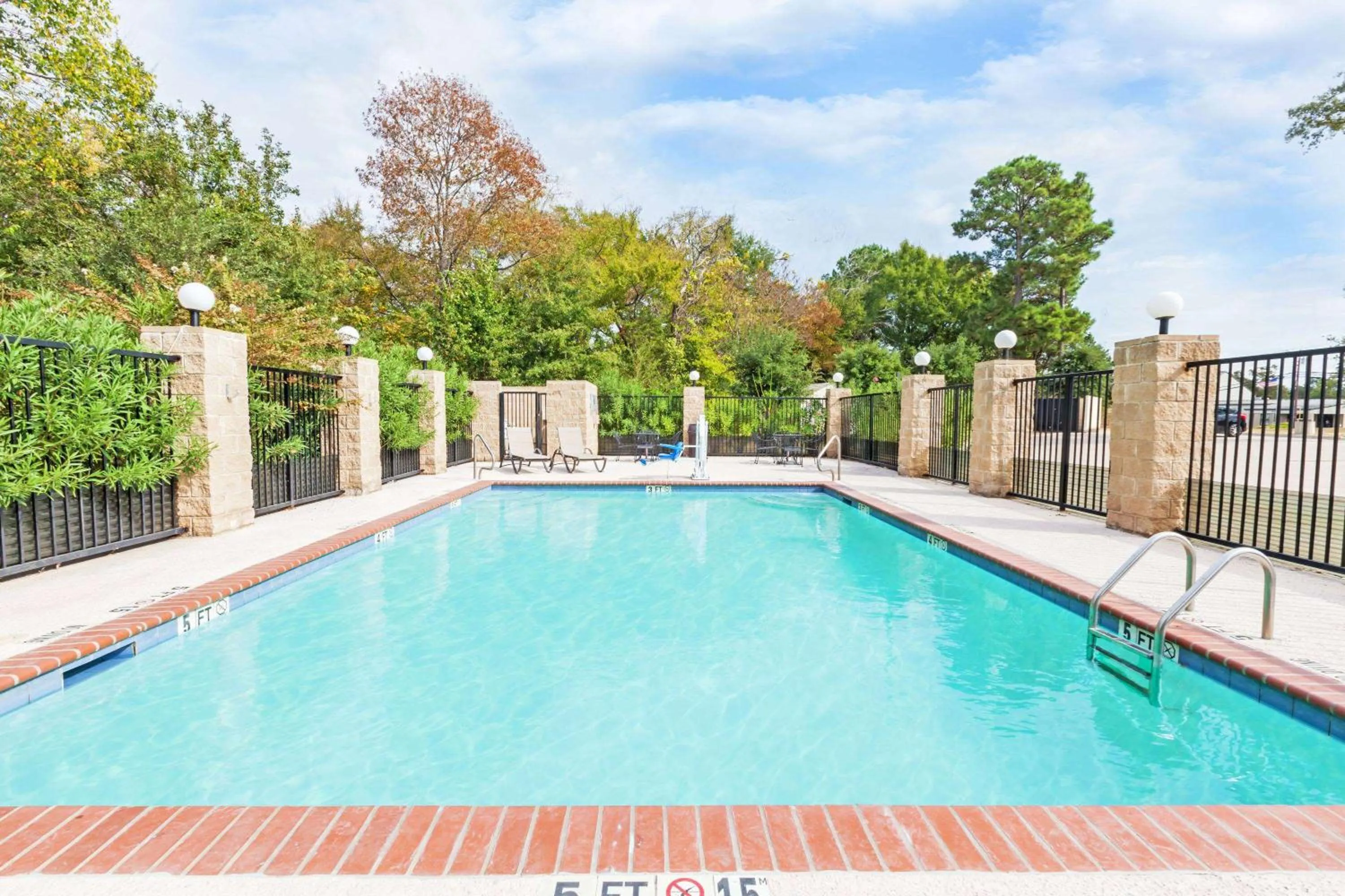 Pool view in Grander Inn & Suites by IHG