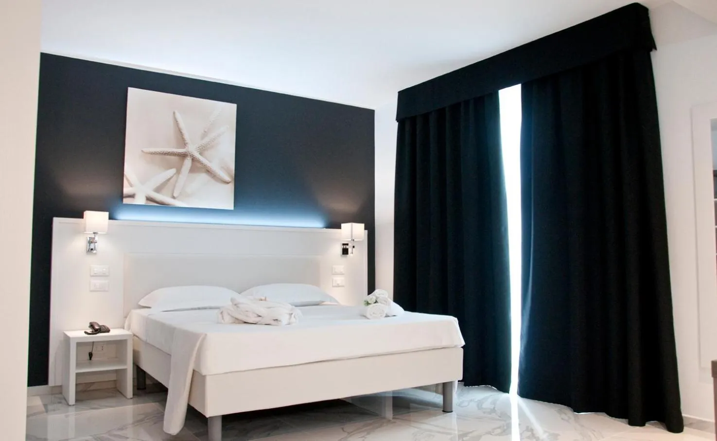 Photo of the whole room, Bed in Ambruosi Village Resort & SPA