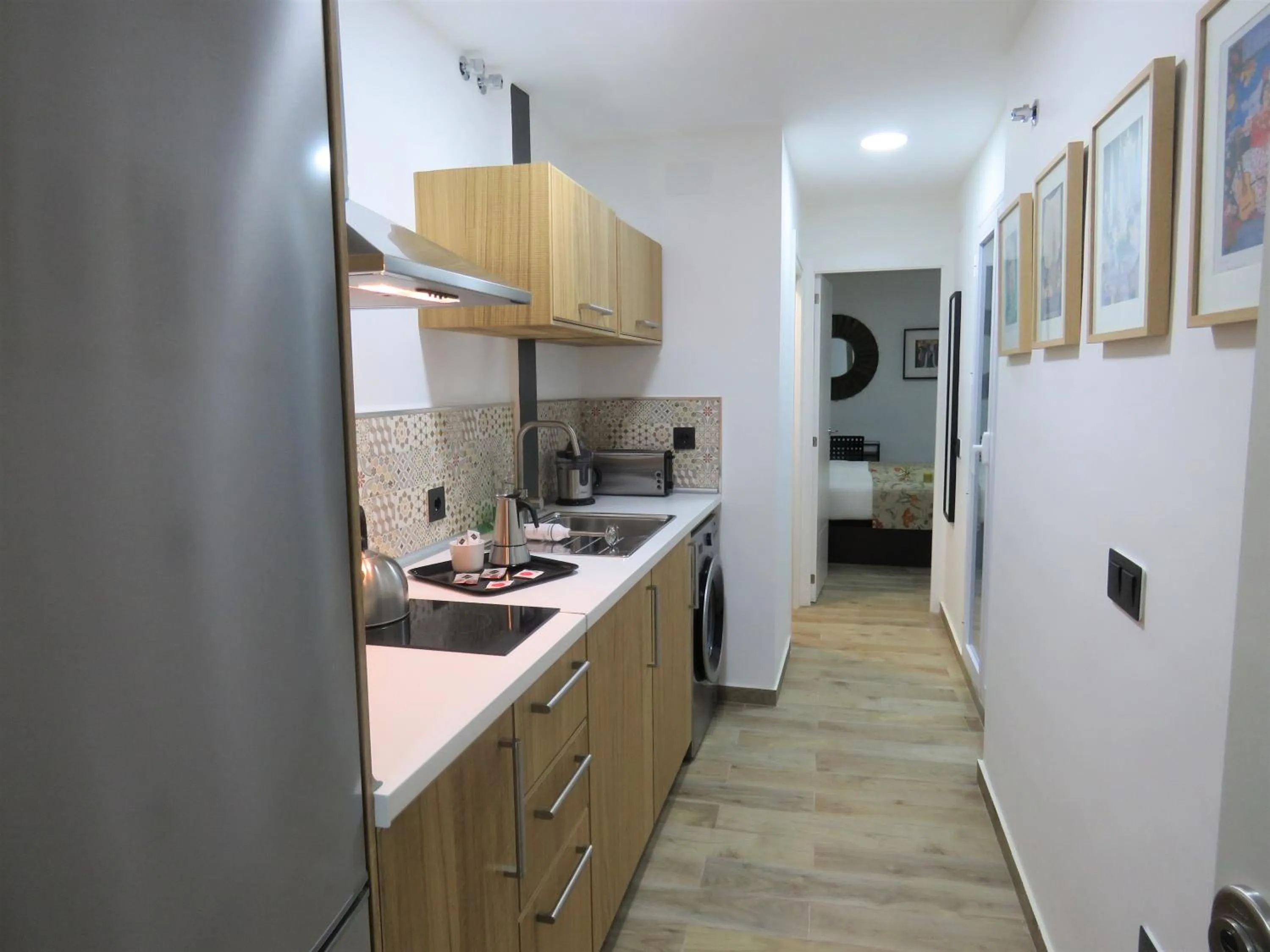 Kitchen or kitchenette in Living Sevilla Apartments Hércules