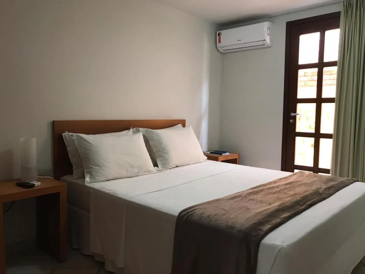 Bed in Pousada Laranja - Nova Administração