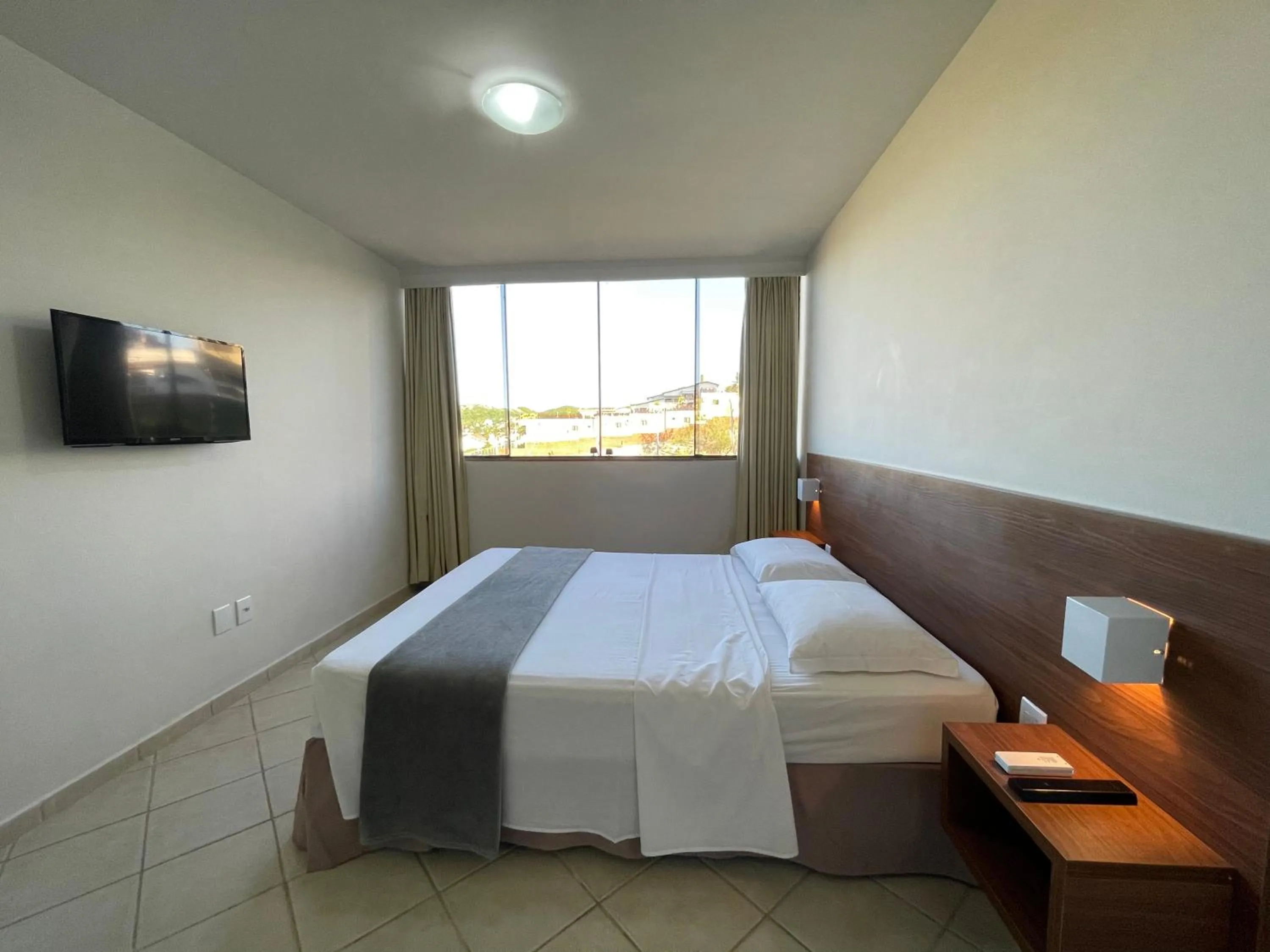 Bed in Pousada Laranja - Nova Administração