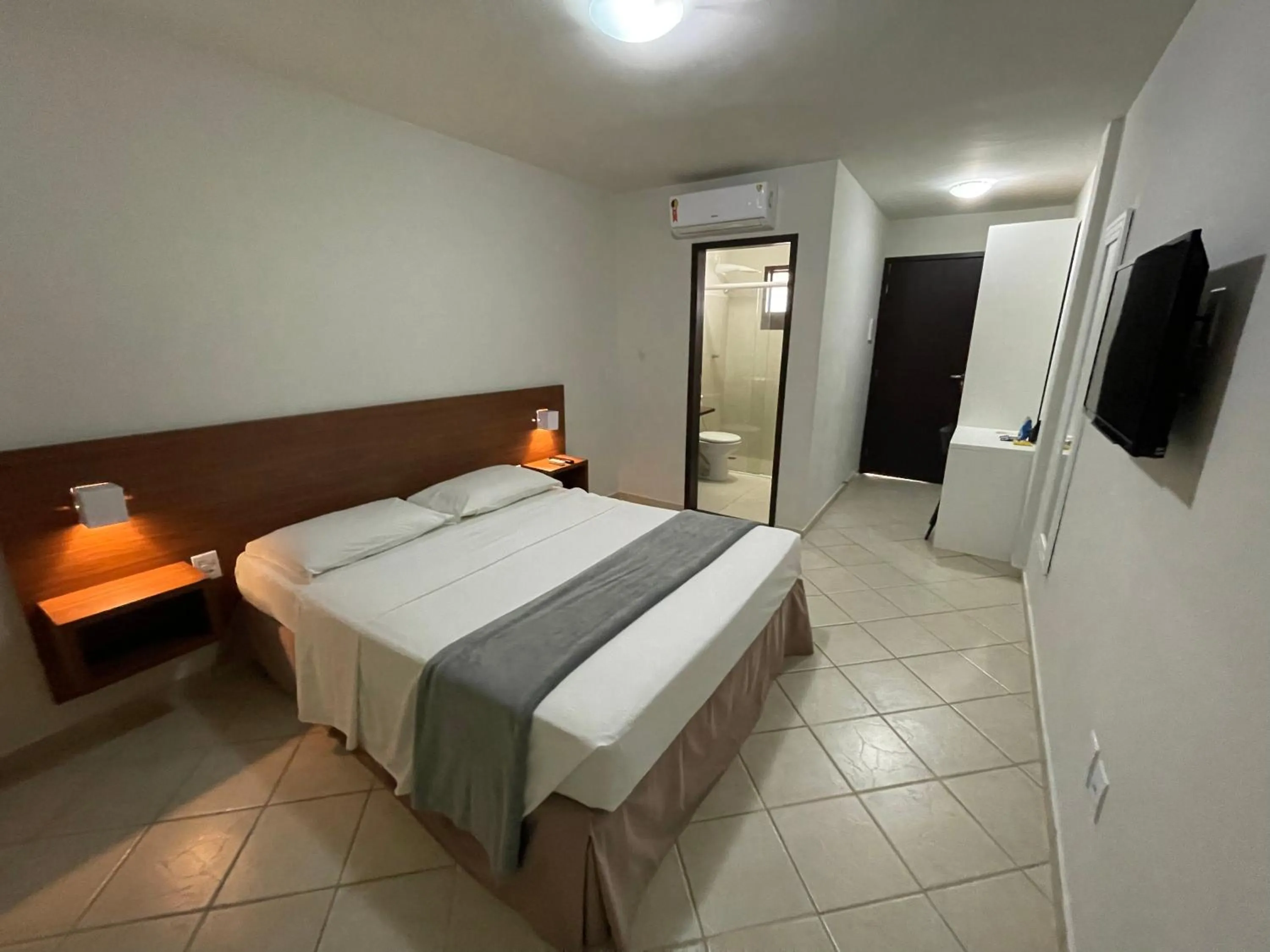 Bed in Pousada Laranja - Nova Administração