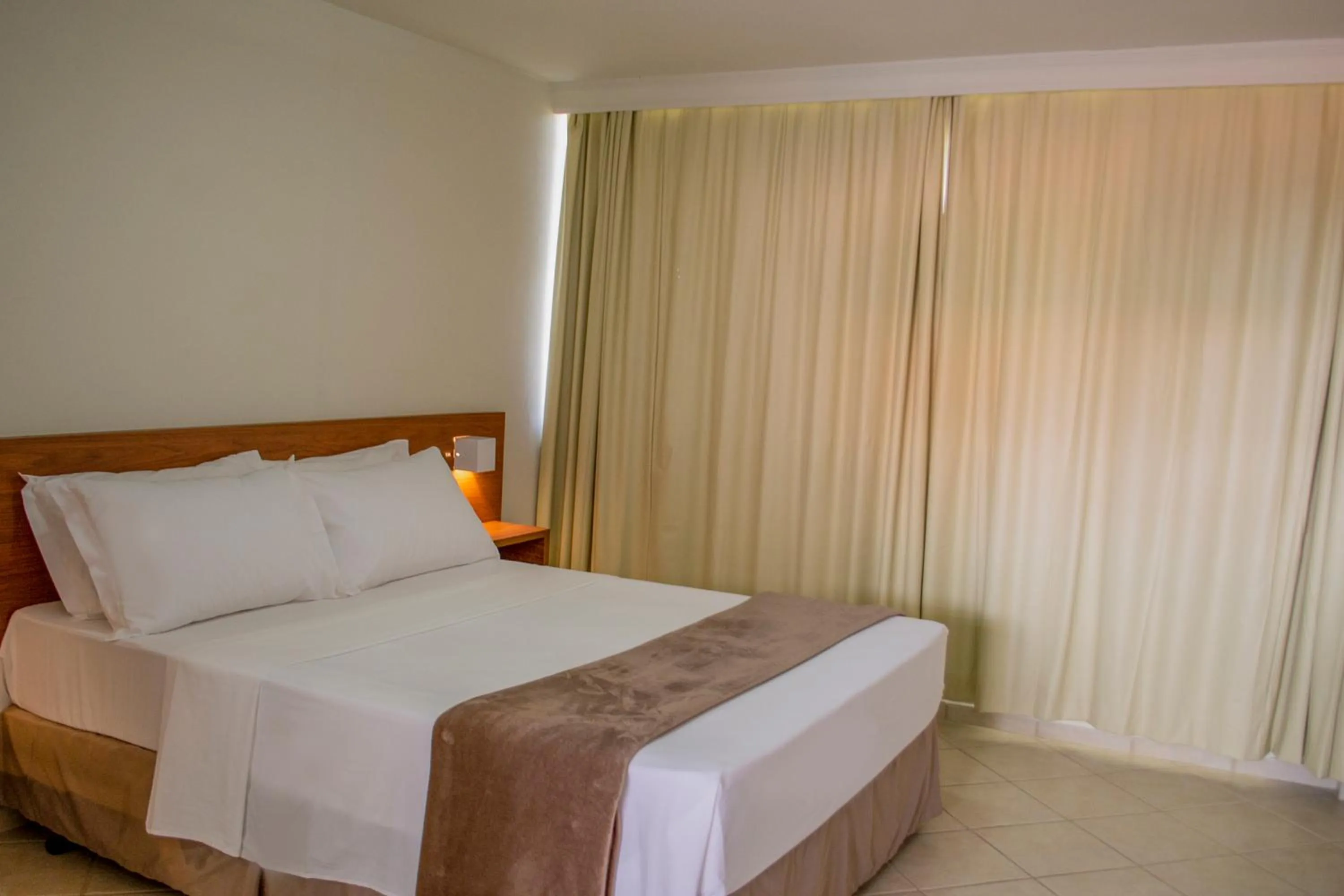 Bed in Pousada Laranja - Nova Administração