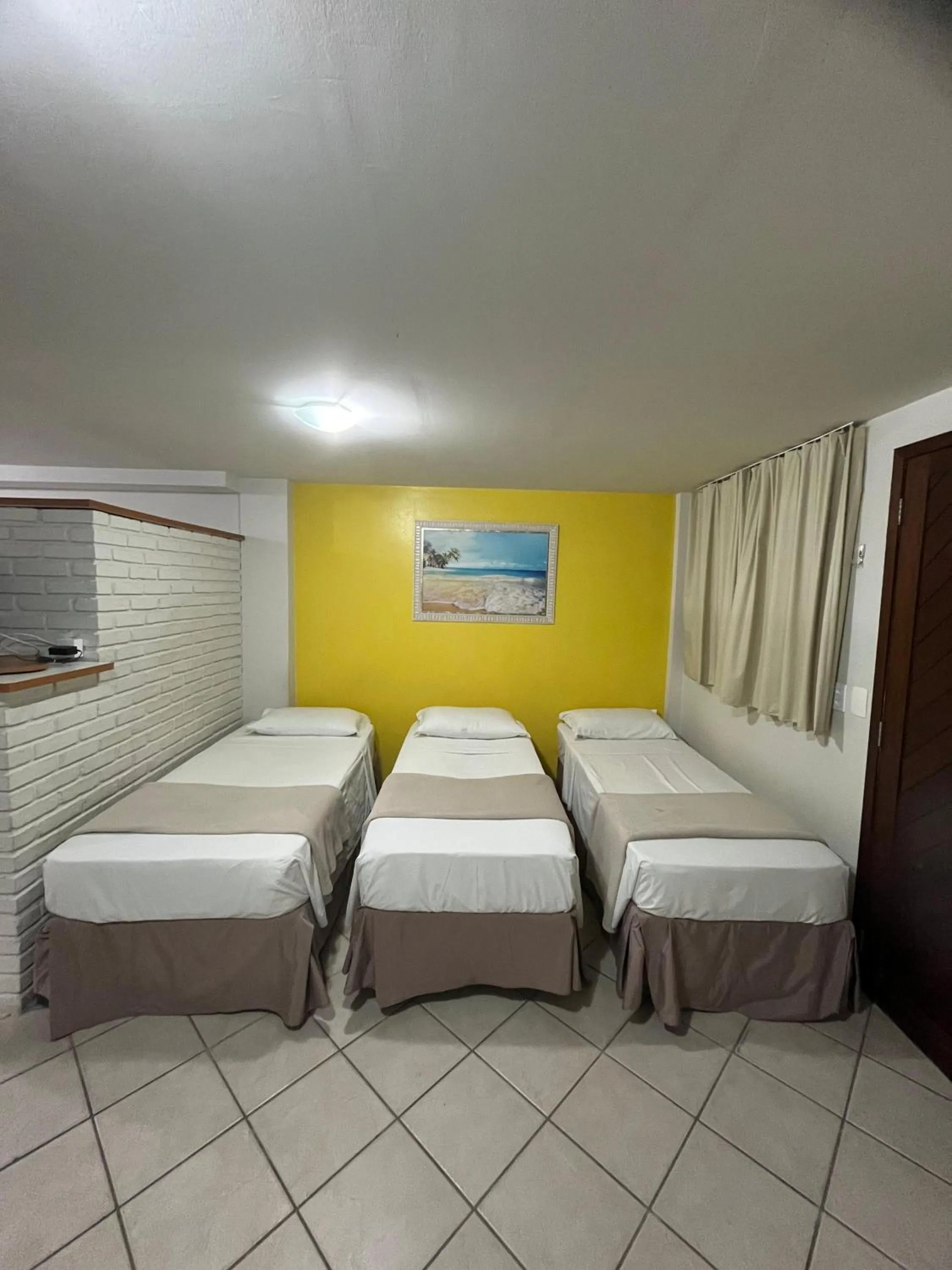 Bed in Pousada Laranja - Nova Administração