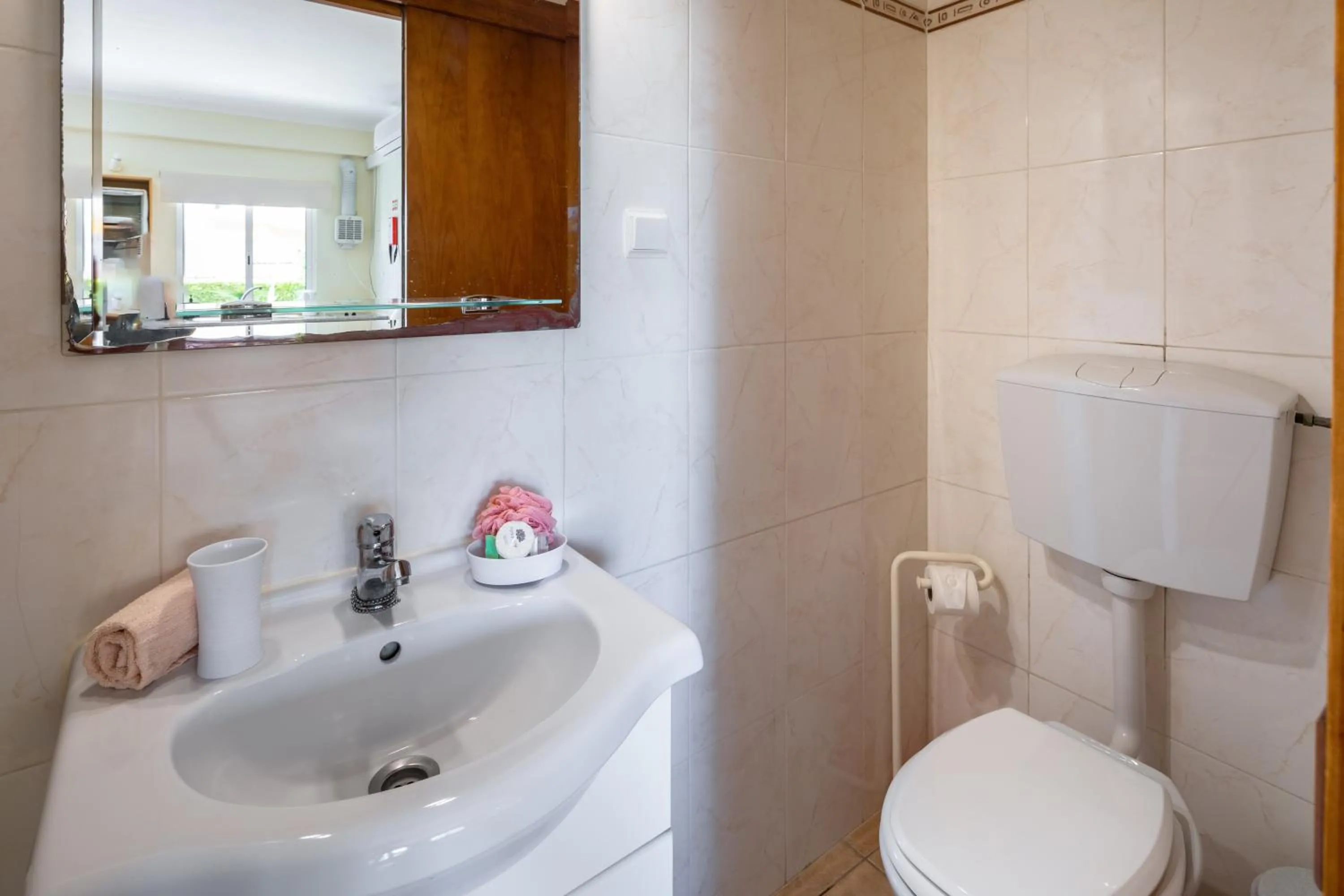 Bathroom in Apartamentos Flor da Laranja, Albufeira by AlgarveBlossom