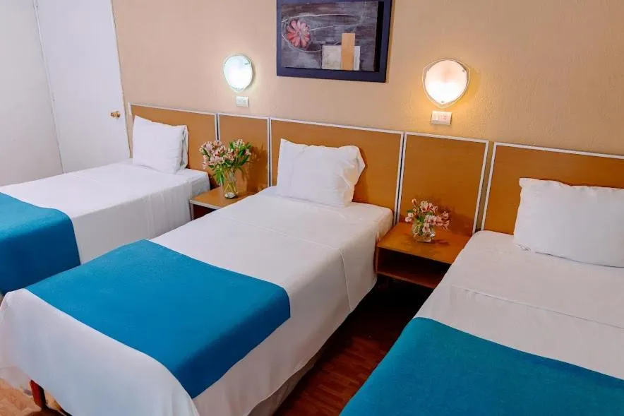 Bed in Kasa Hotel & Suites