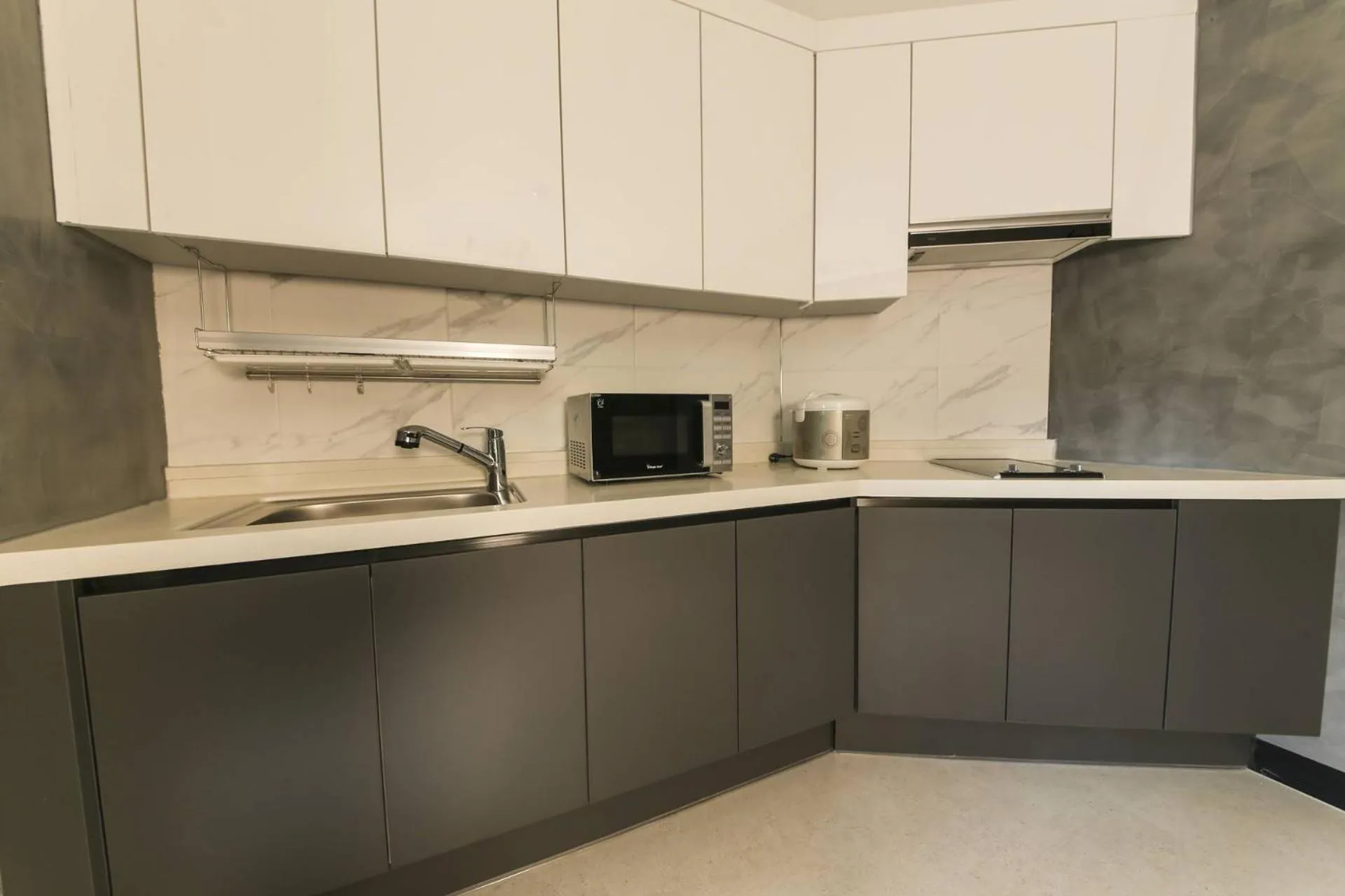 Kitchen/Kitchenette in almond hotel Gupo station