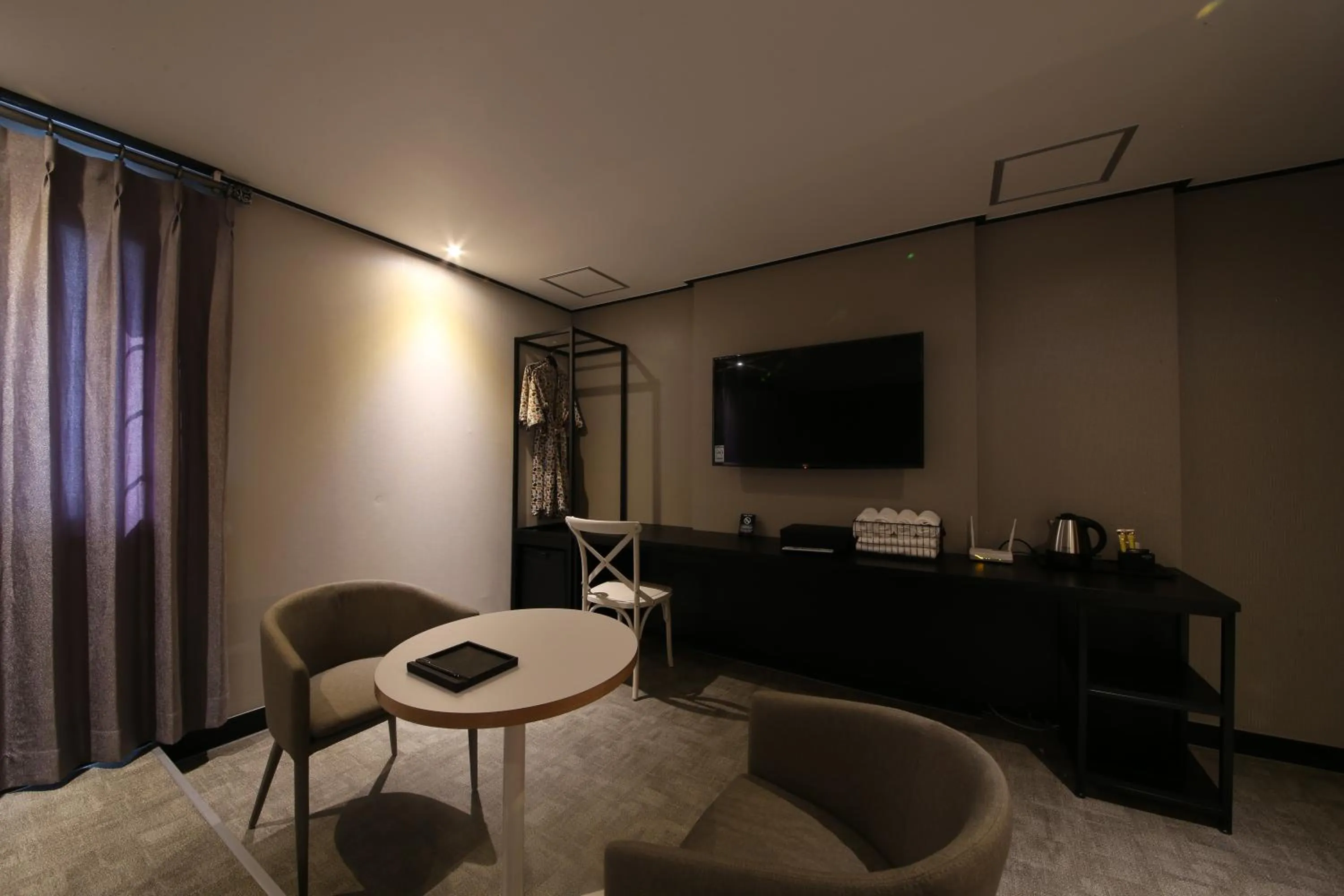 TV/Entertainment Center in almond hotel Gupo station