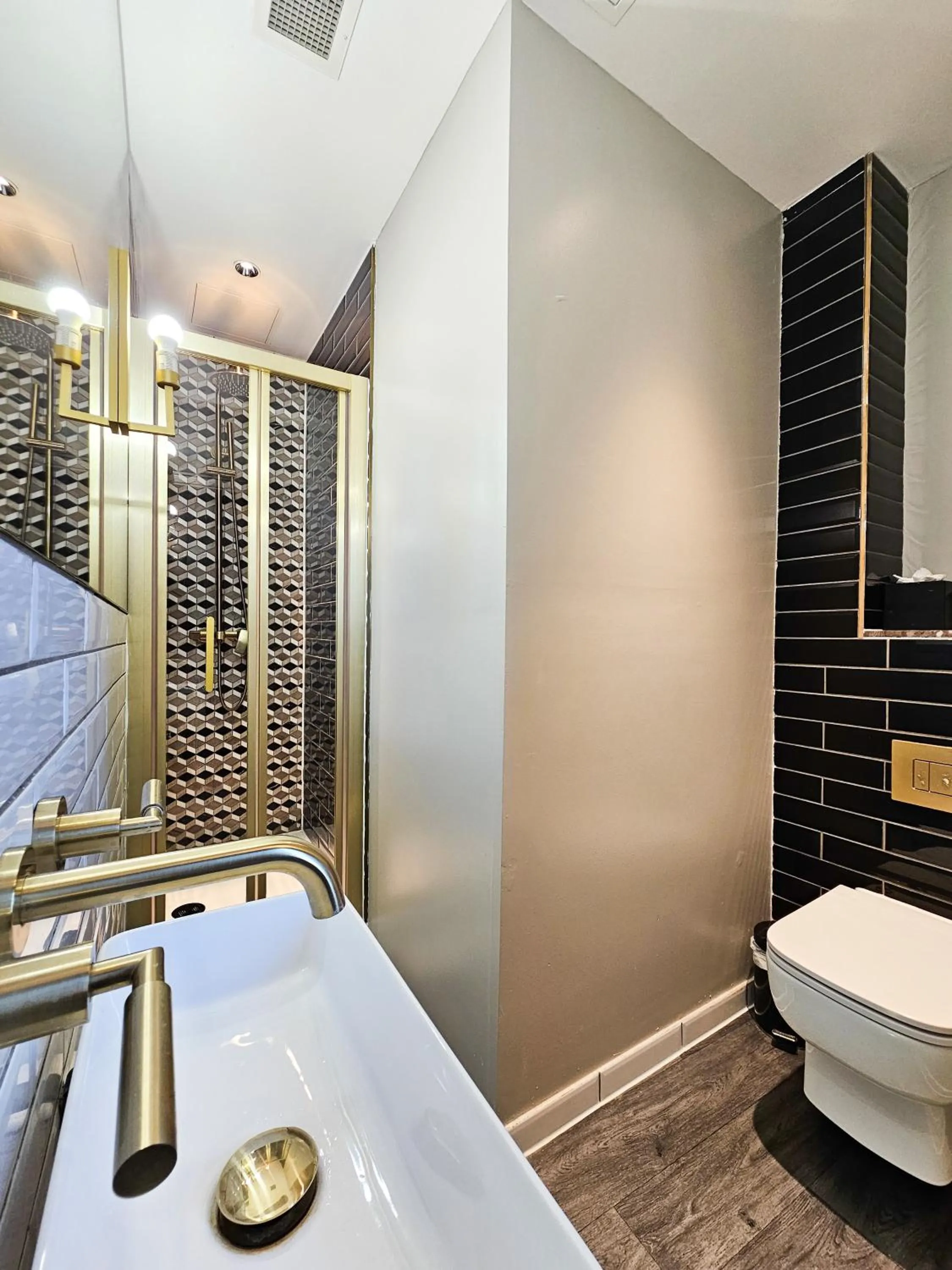 Shower in Henrietta House, a member of Radisson Individuals