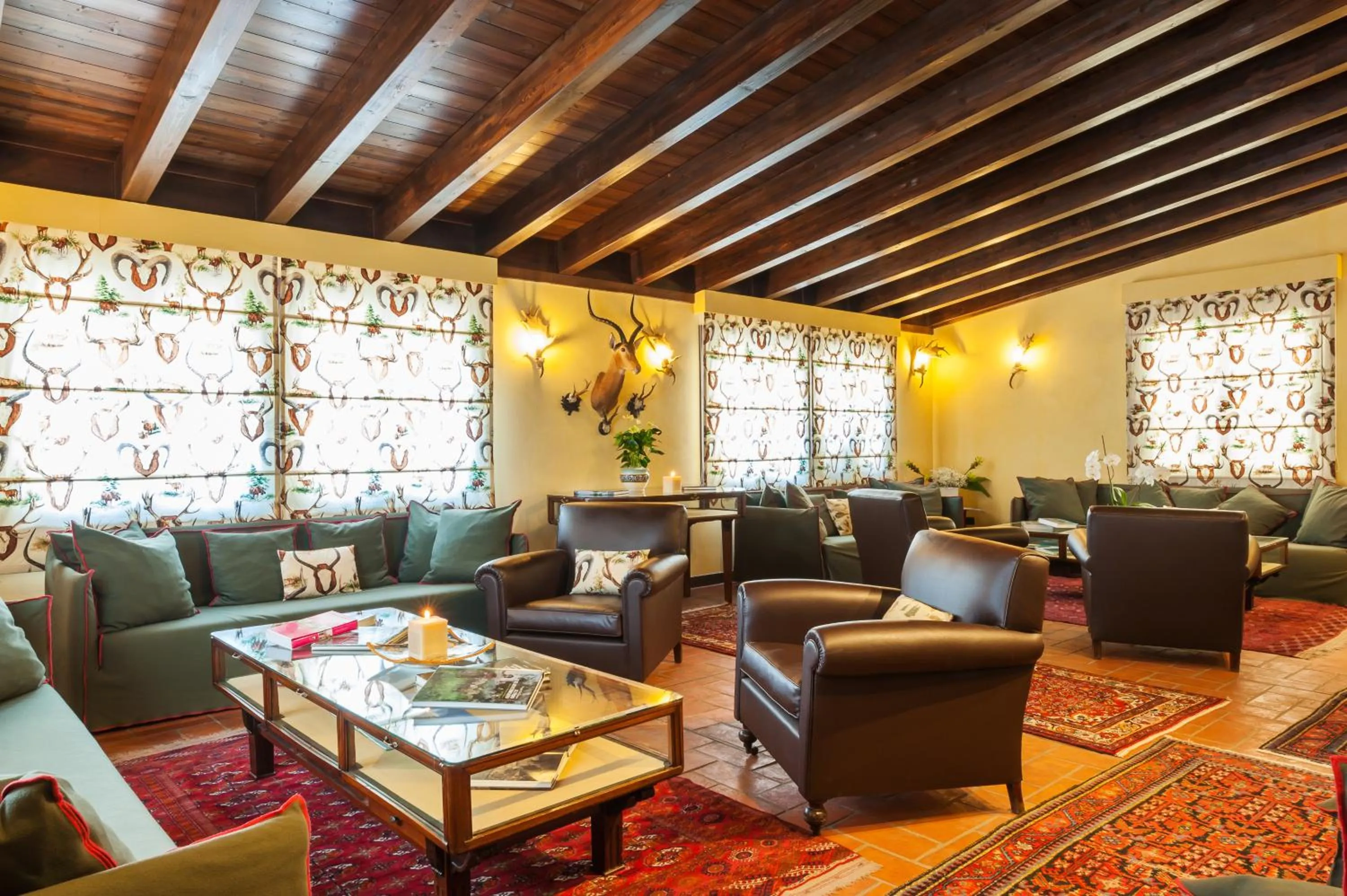 Communal lounge/ TV room in Relais Ducale Spa & Pool